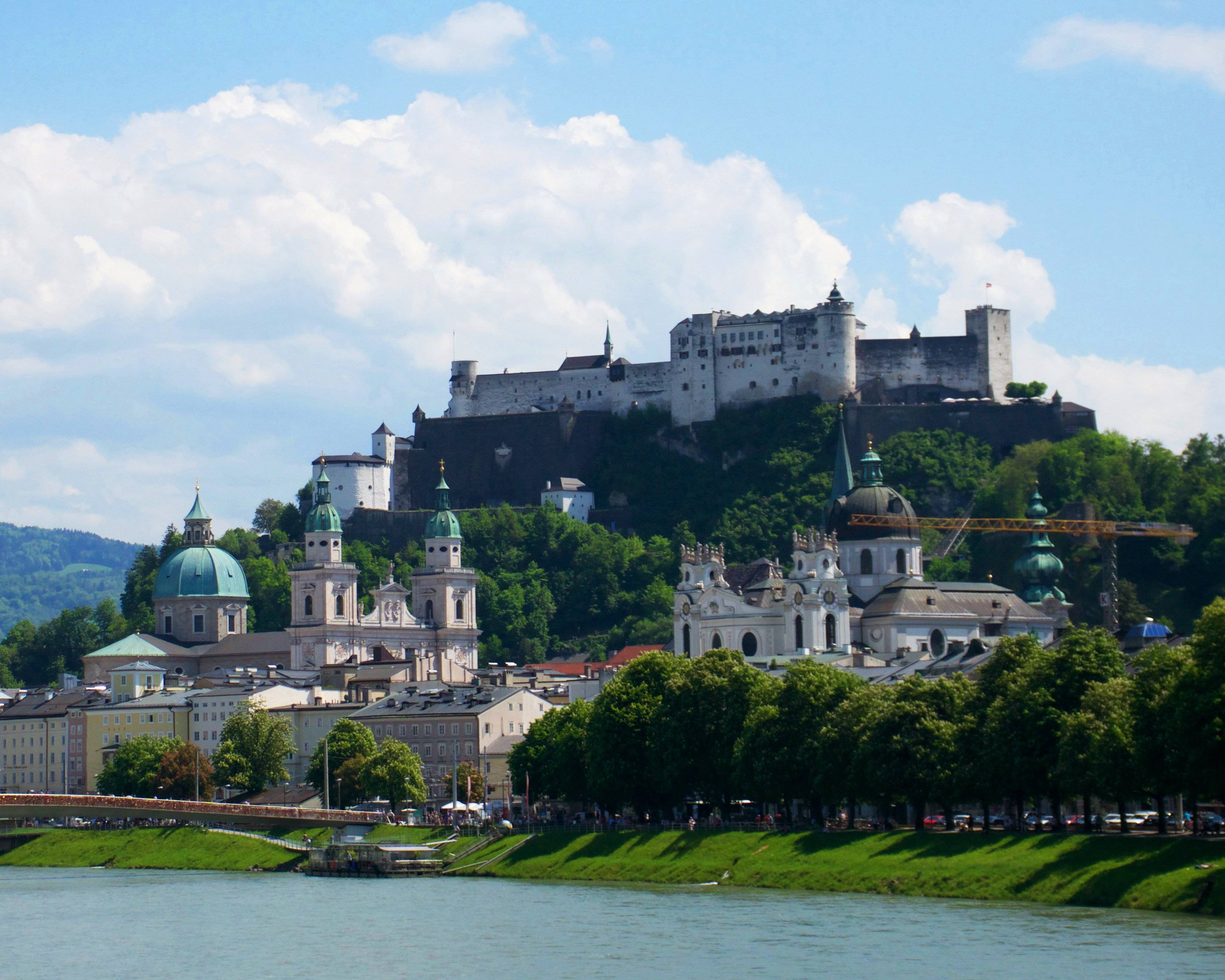 a city with a castle on top of it