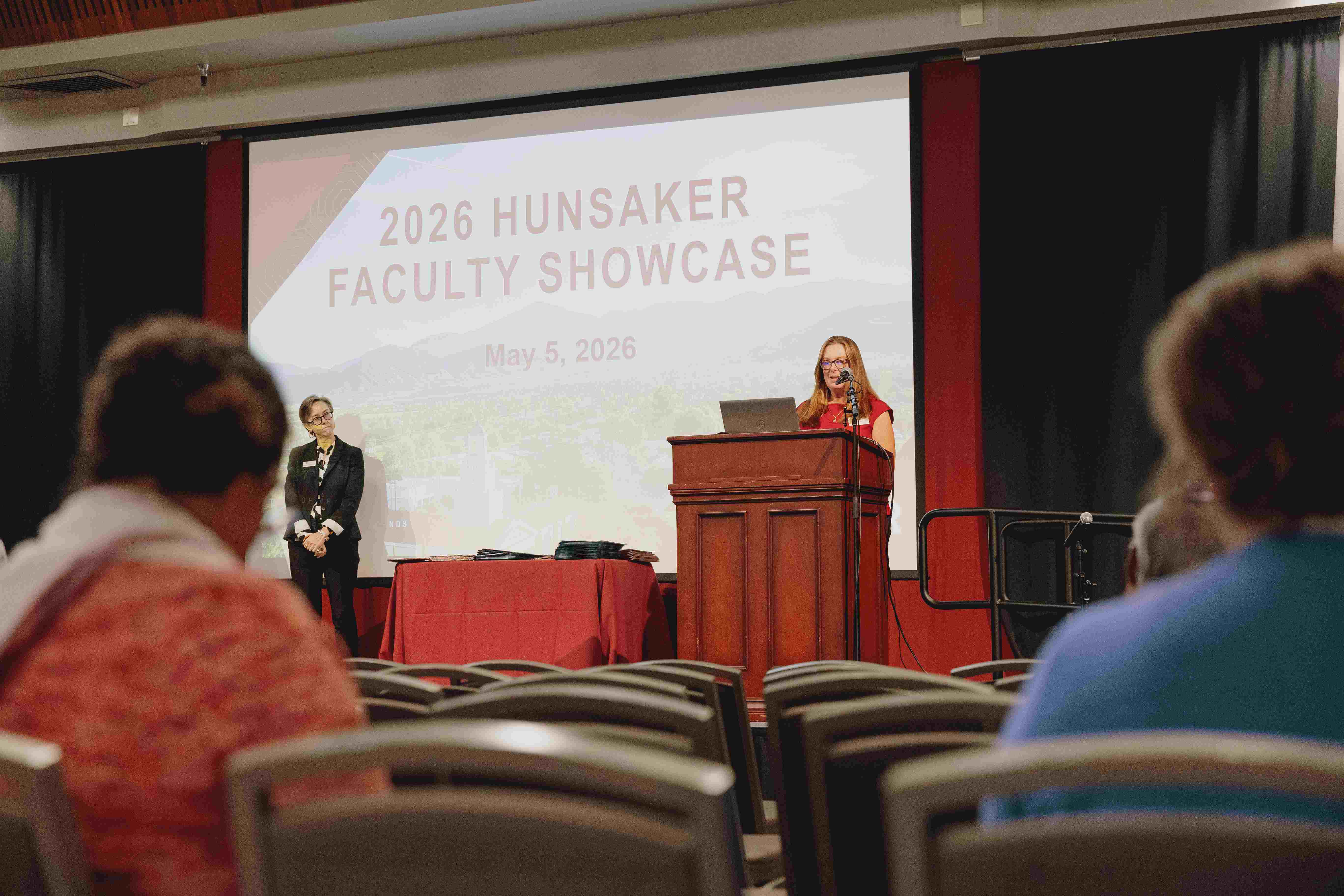 a person speaking at a podium