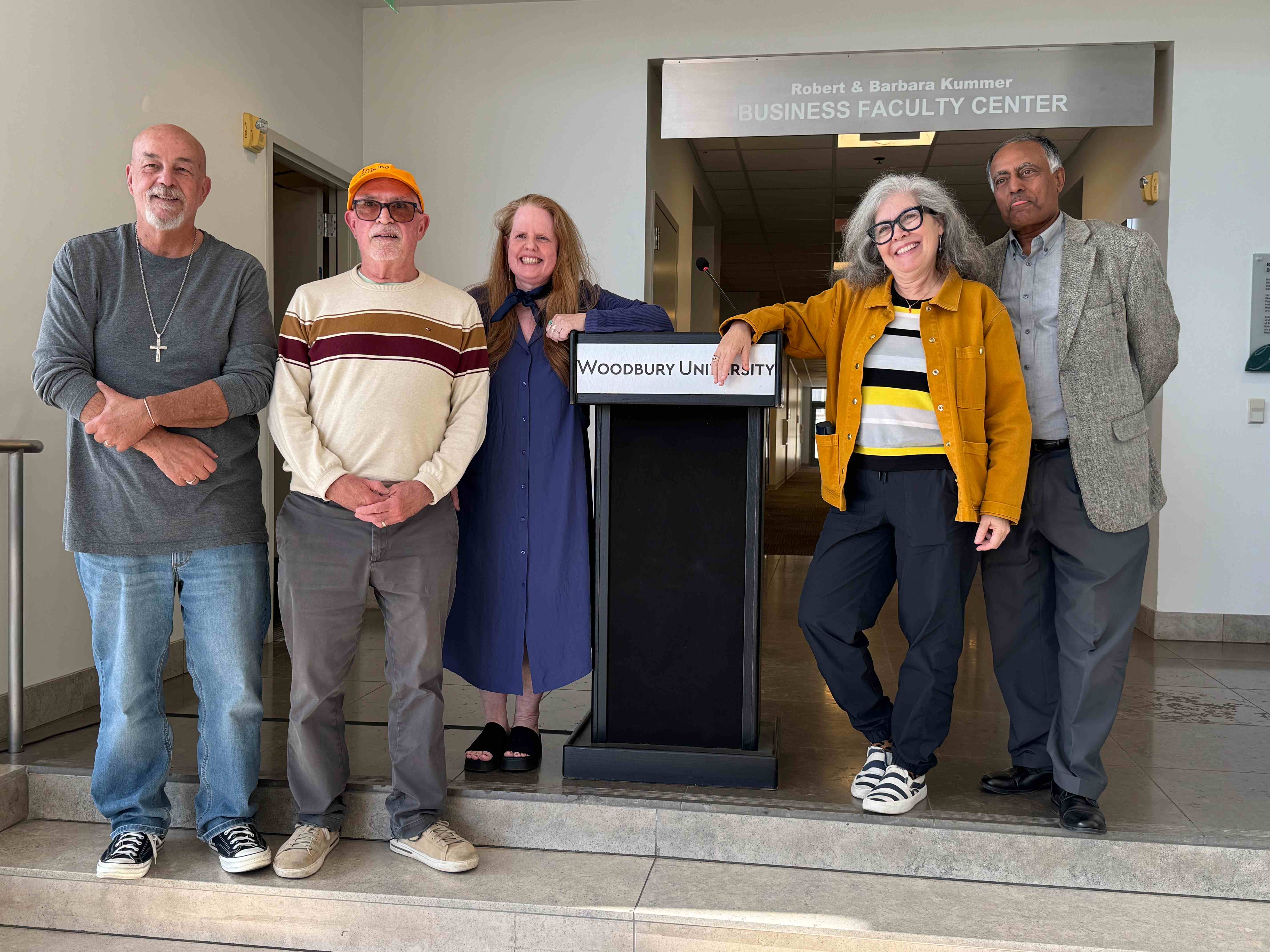 a group of people standing in front of a podium
