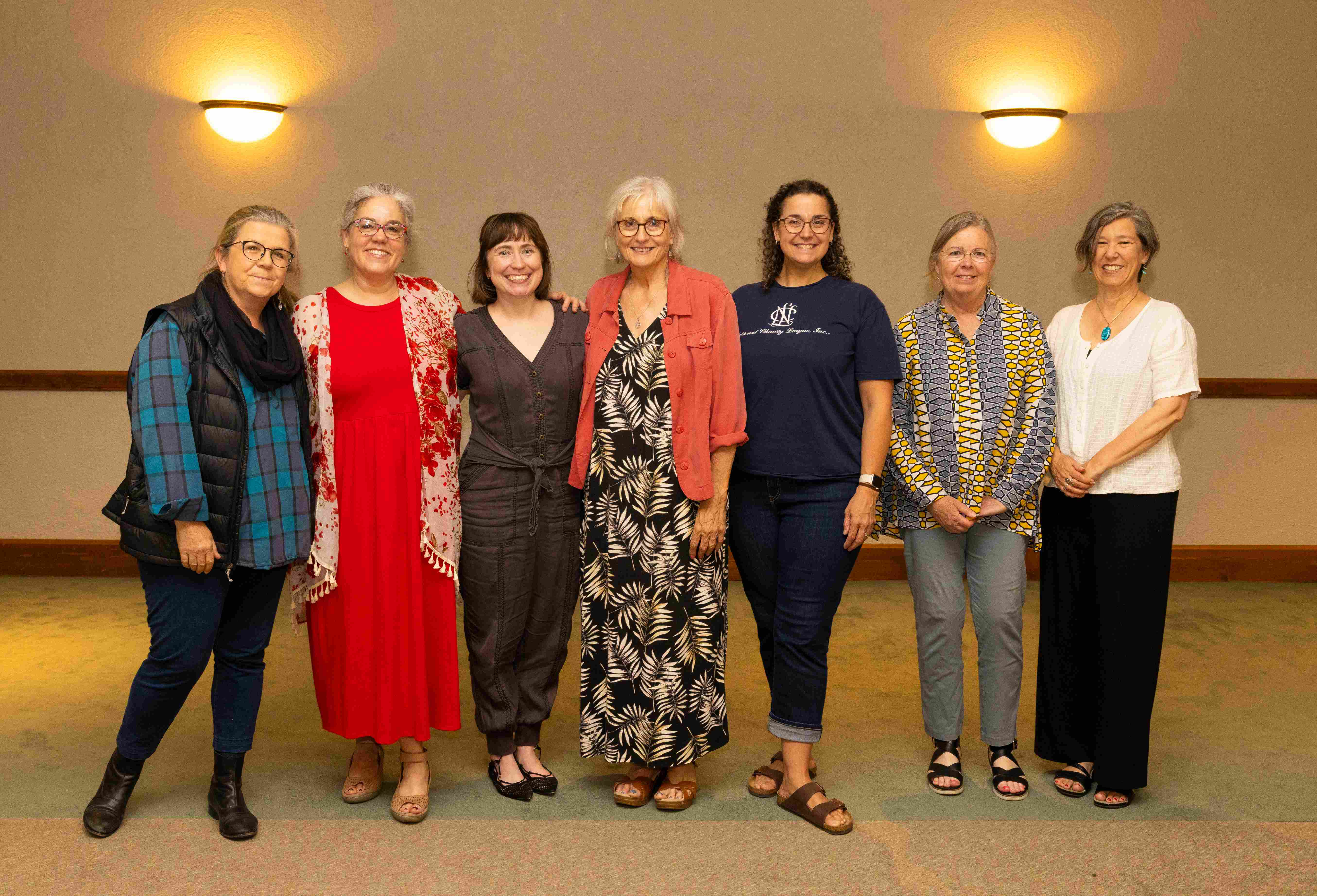 a group of women posing for a photo