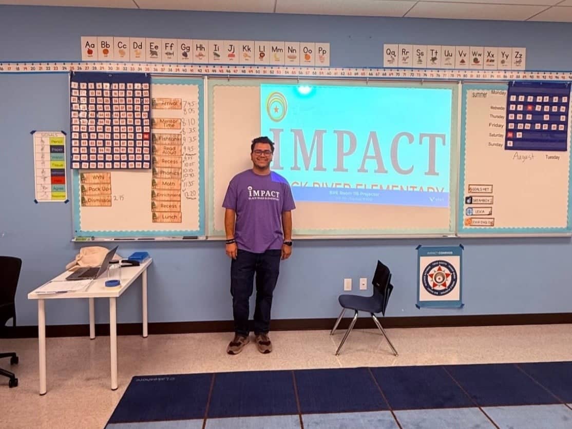 a person standing in front of a whiteboard