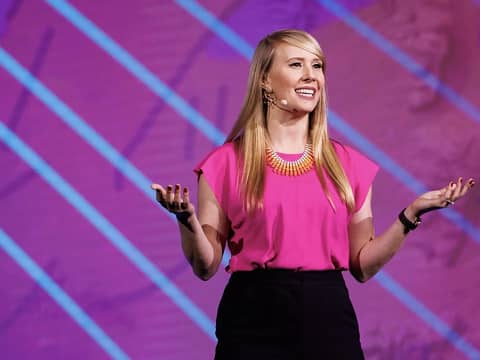 a person in pink shirt and black pants