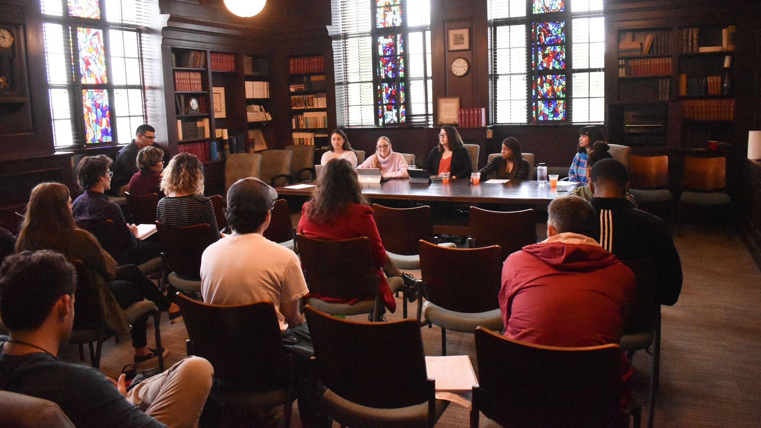 a group of people sitting in a room