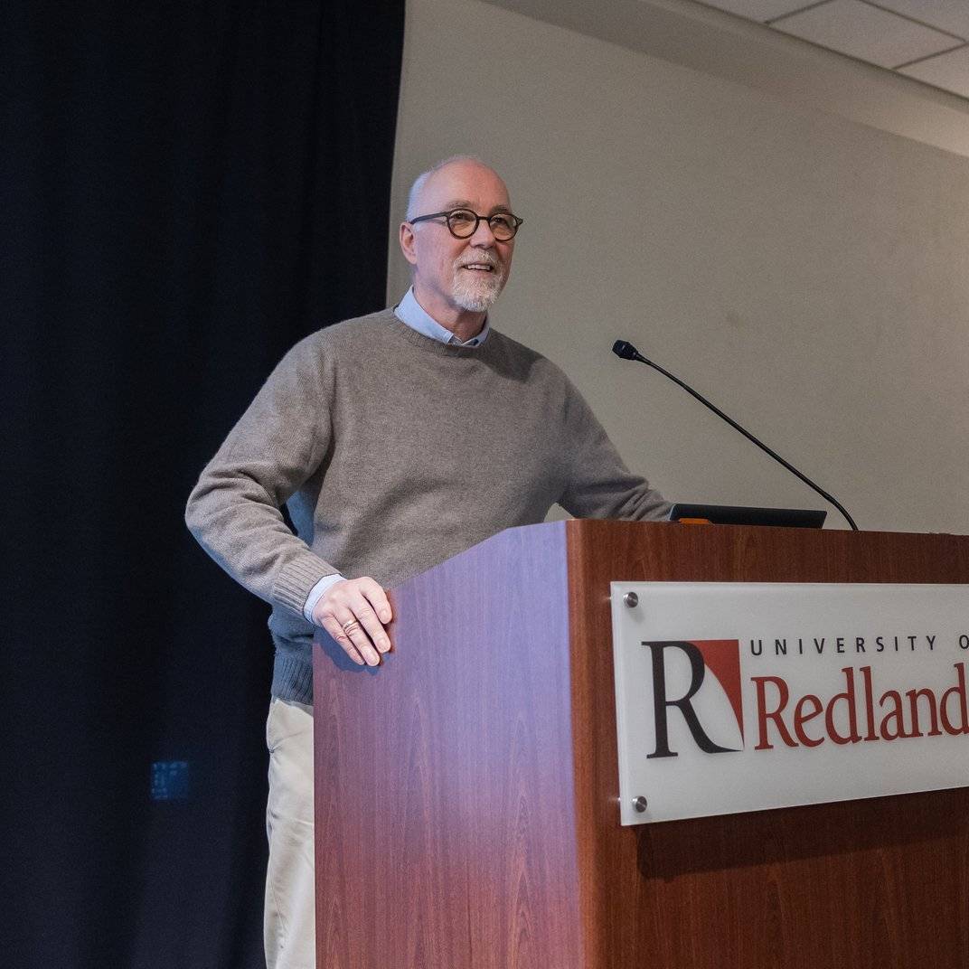 a person standing at a podium