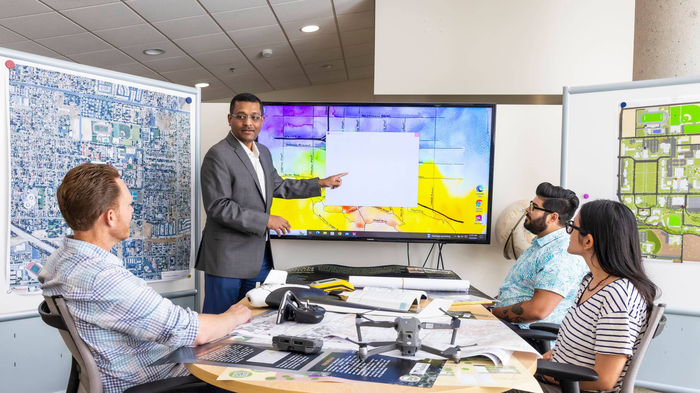 a person pointing at a screen