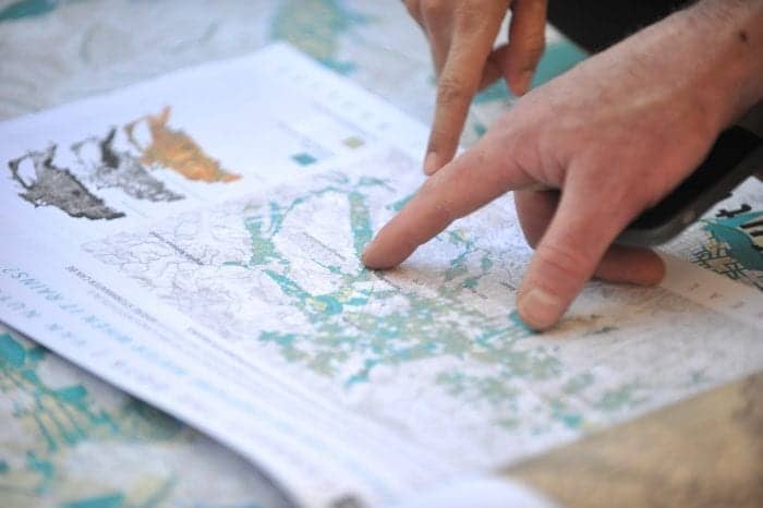 a person pointing at a map