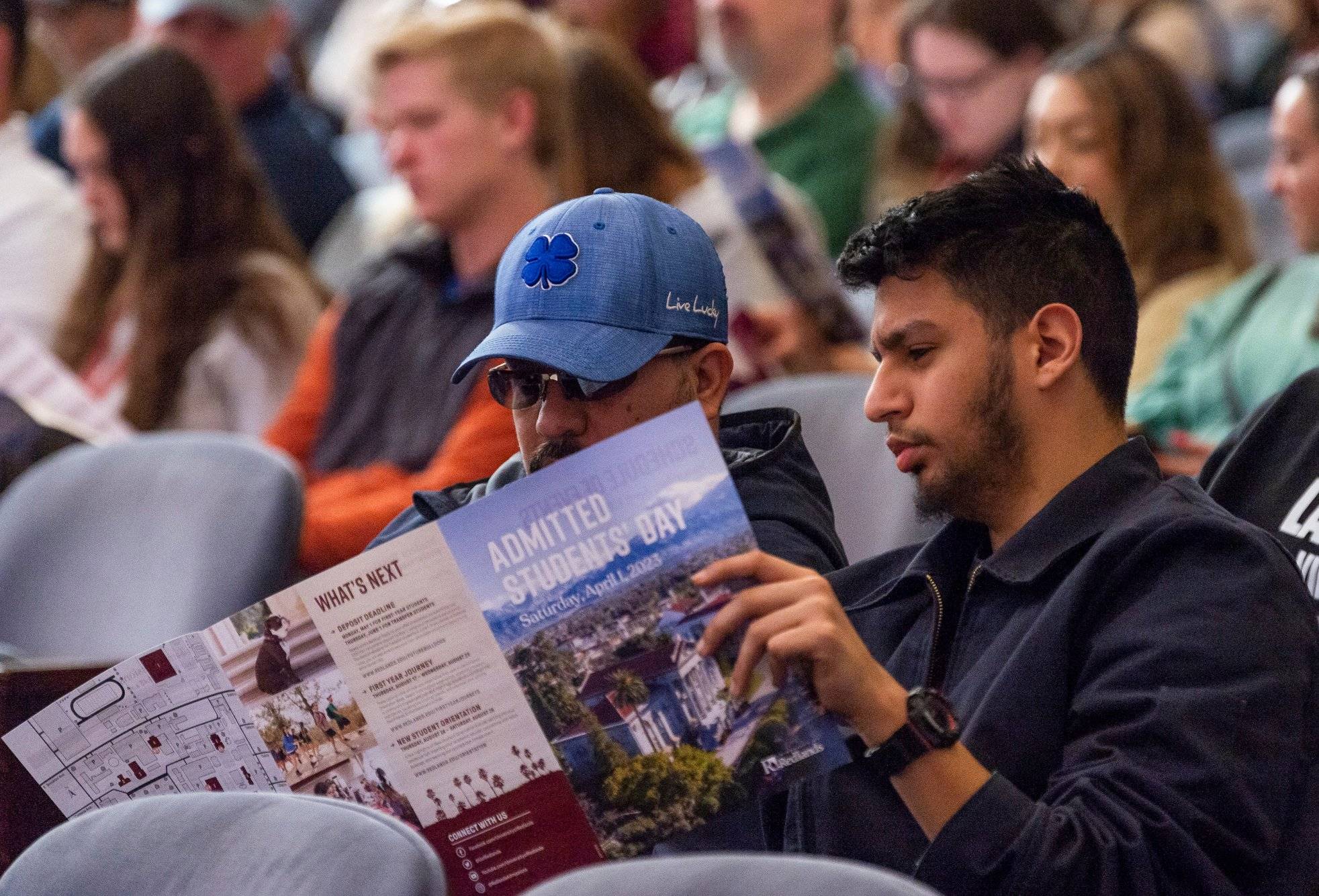 a person reading a magazine in a room