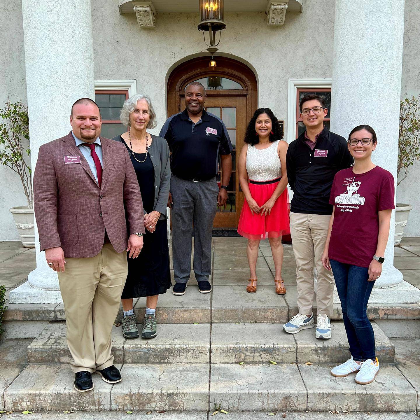a group of people standing in front of a building