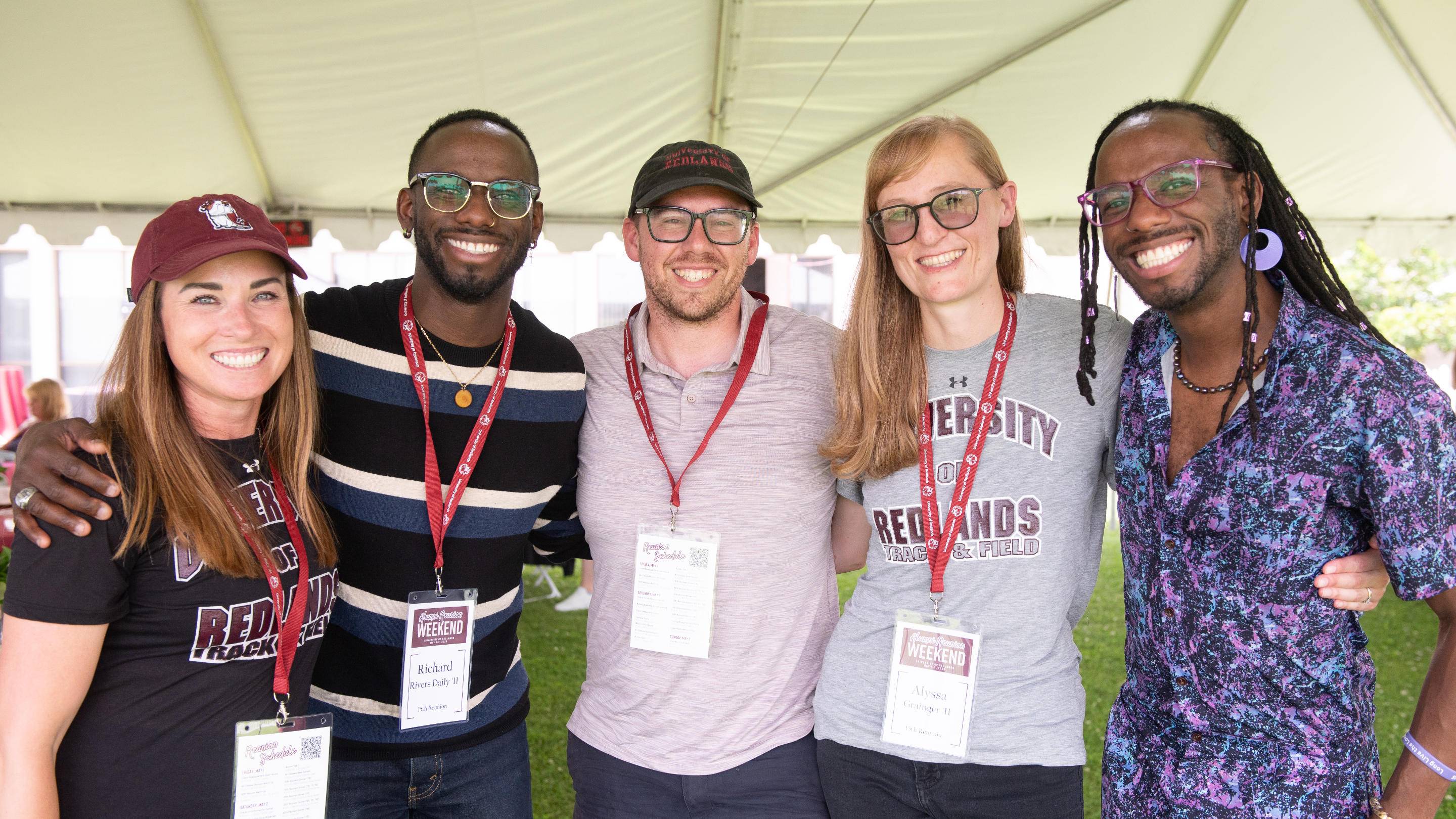 a group of people standing together under a tent