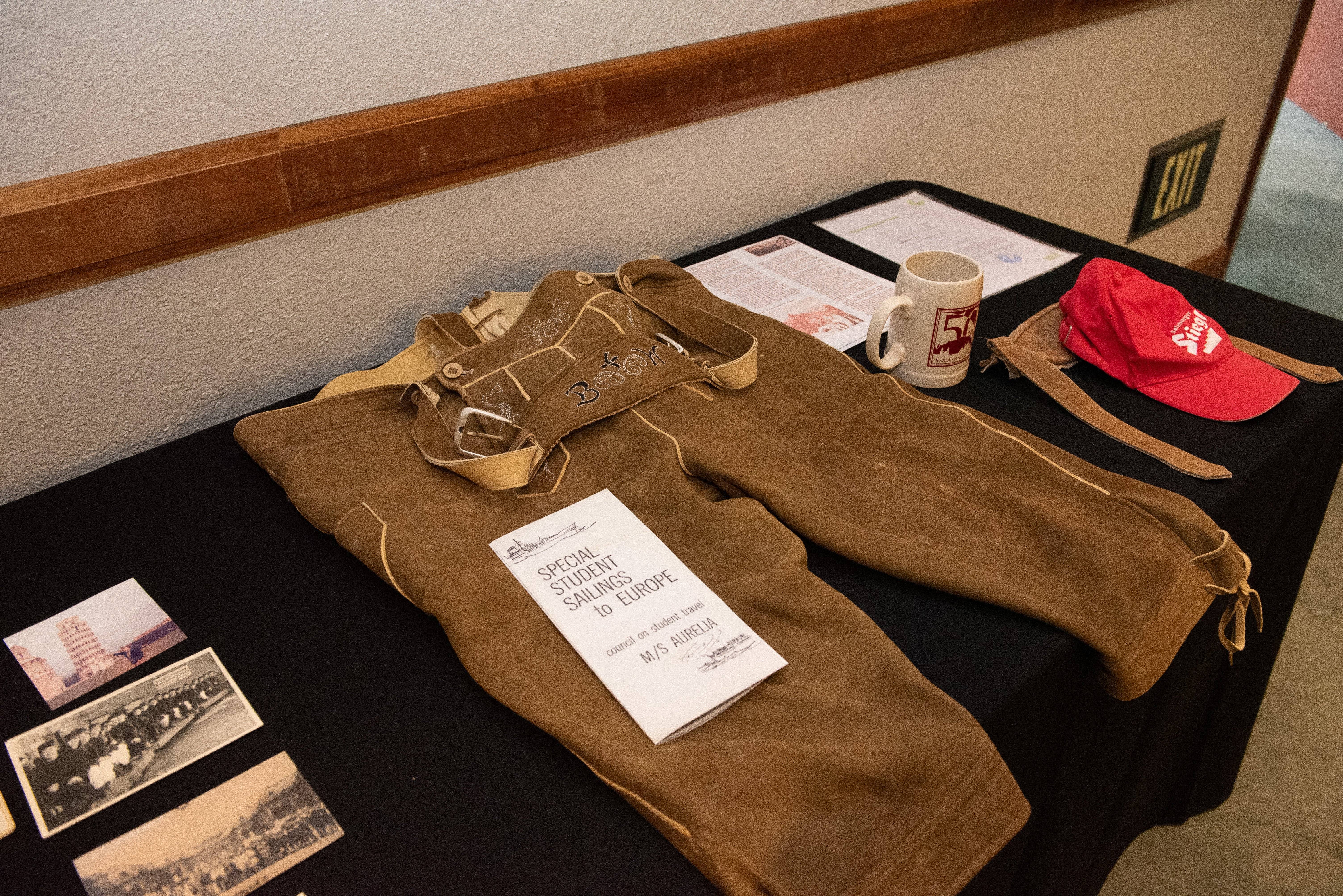 a brown overalls and a mug on a table