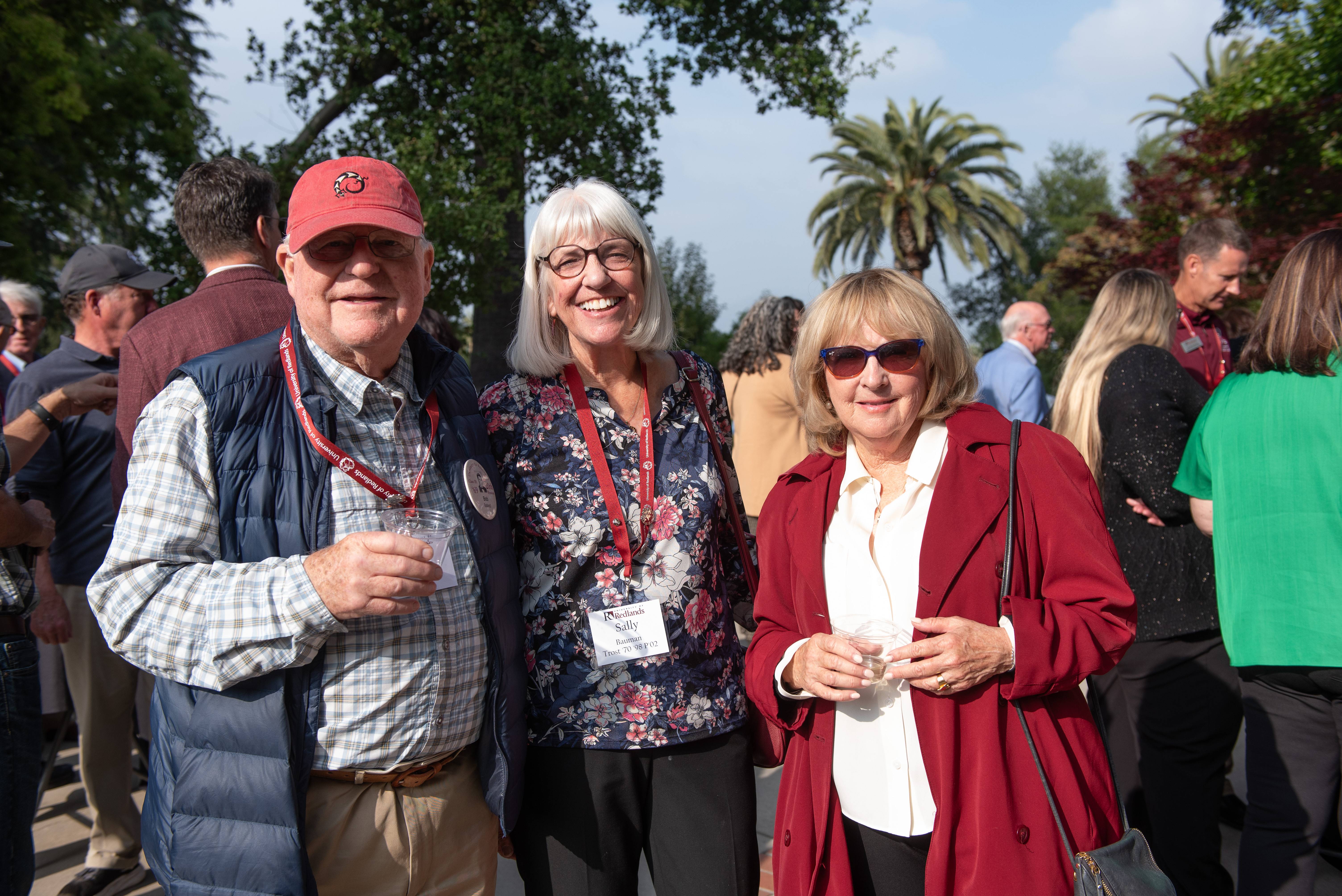 a group of people standing together smiling