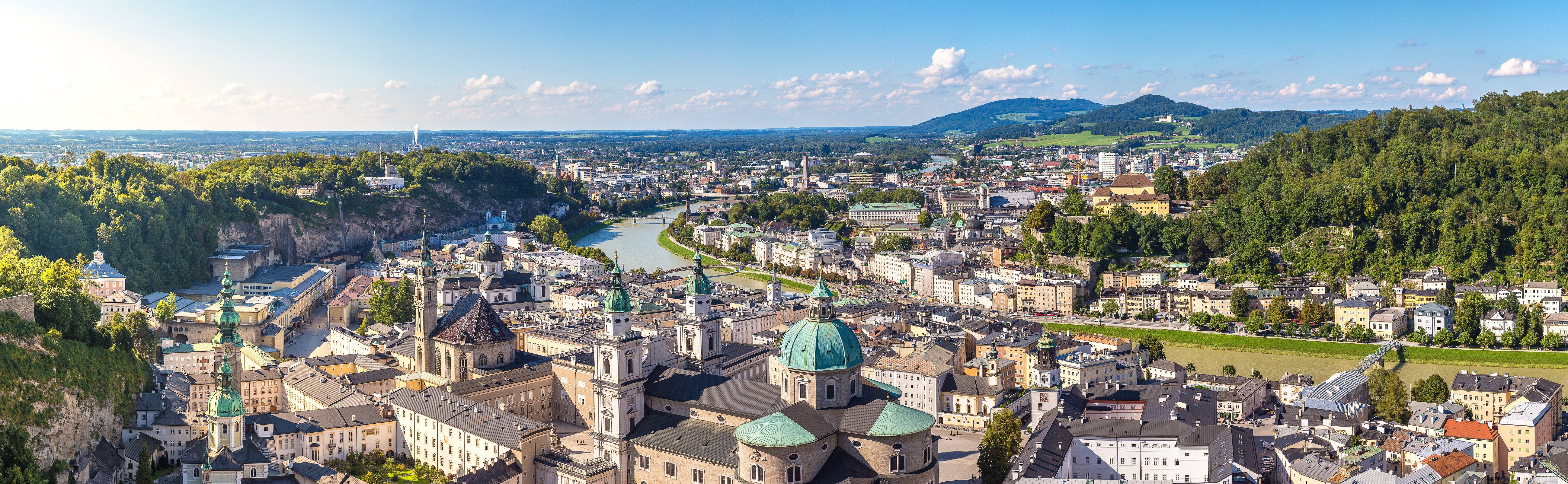 a city with a river and a large building