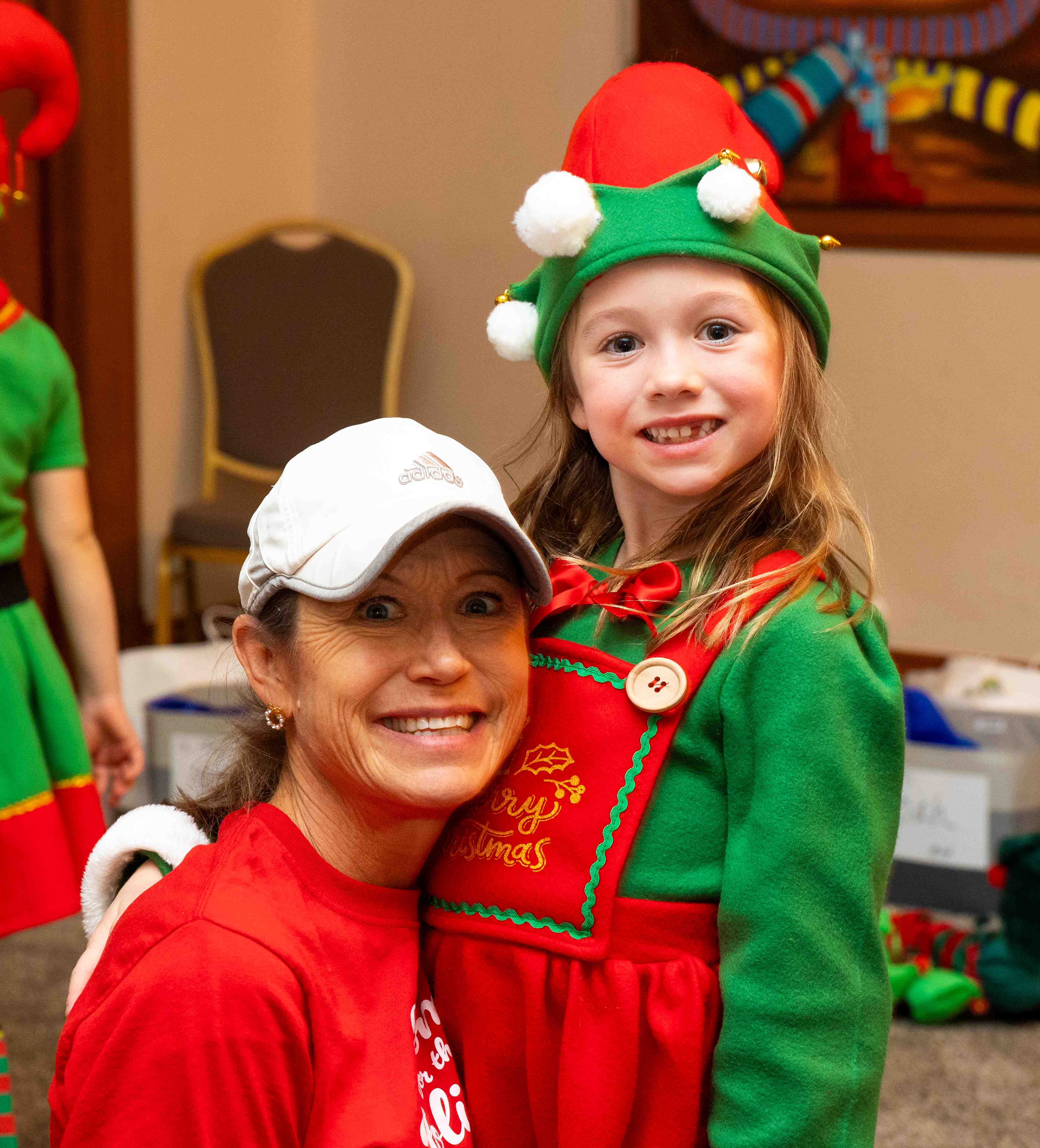 a person and a child wearing elf clothing
