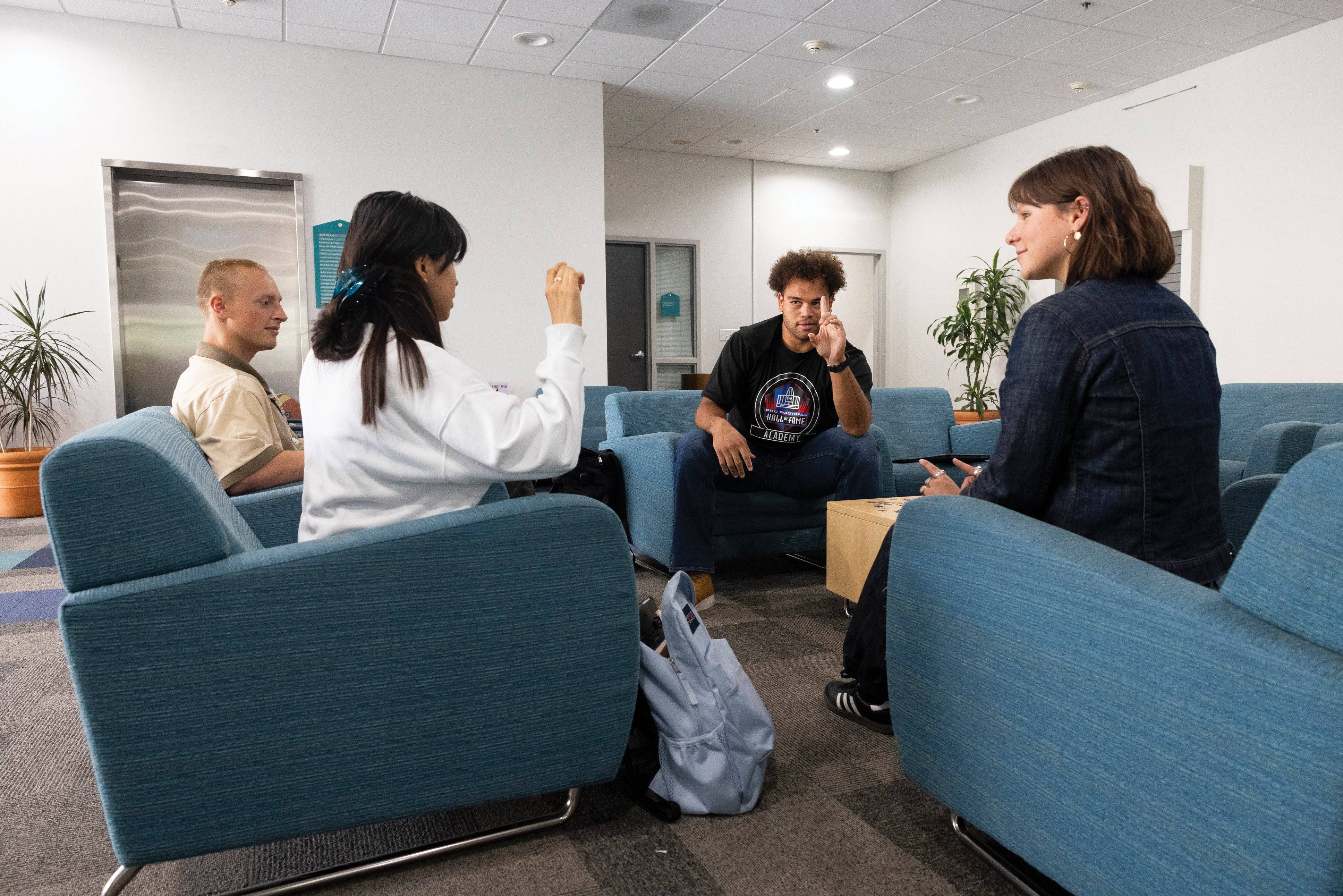 a group of people sitting in chairs