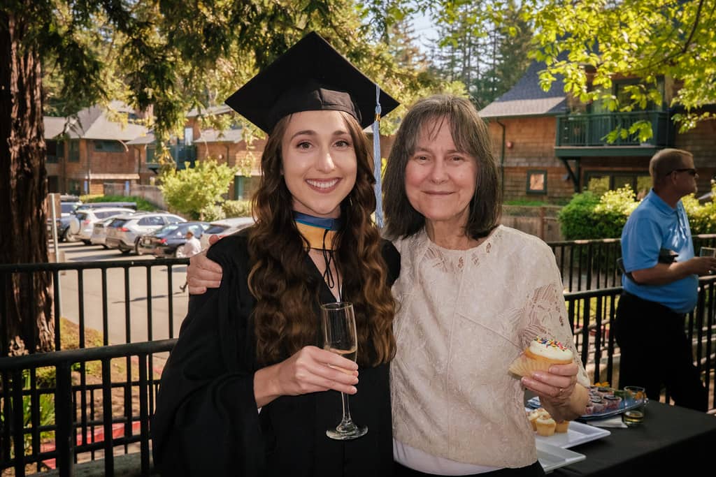 a person in a cap and gown with a person in a cap and gown