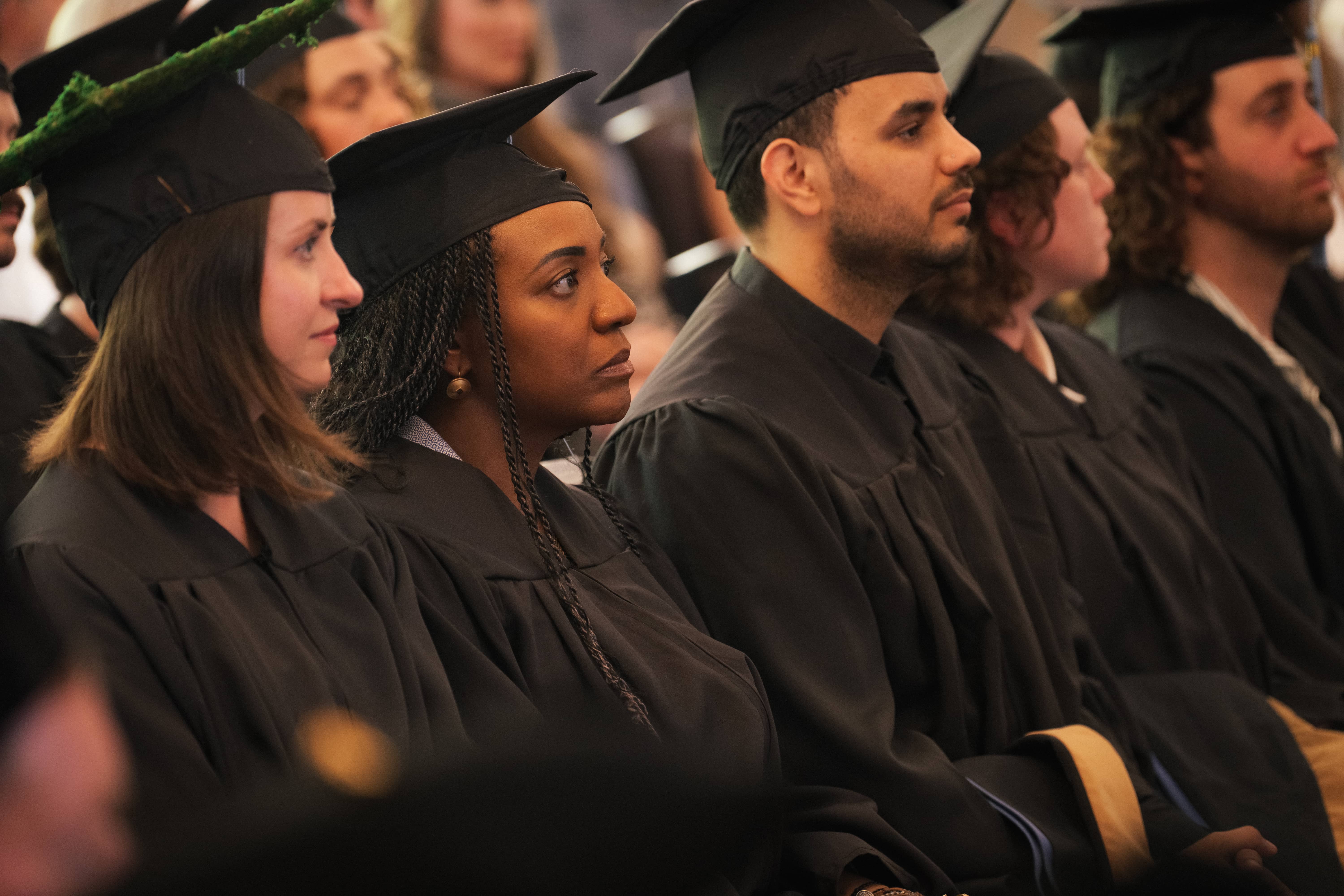 a group of people in graduation gowns