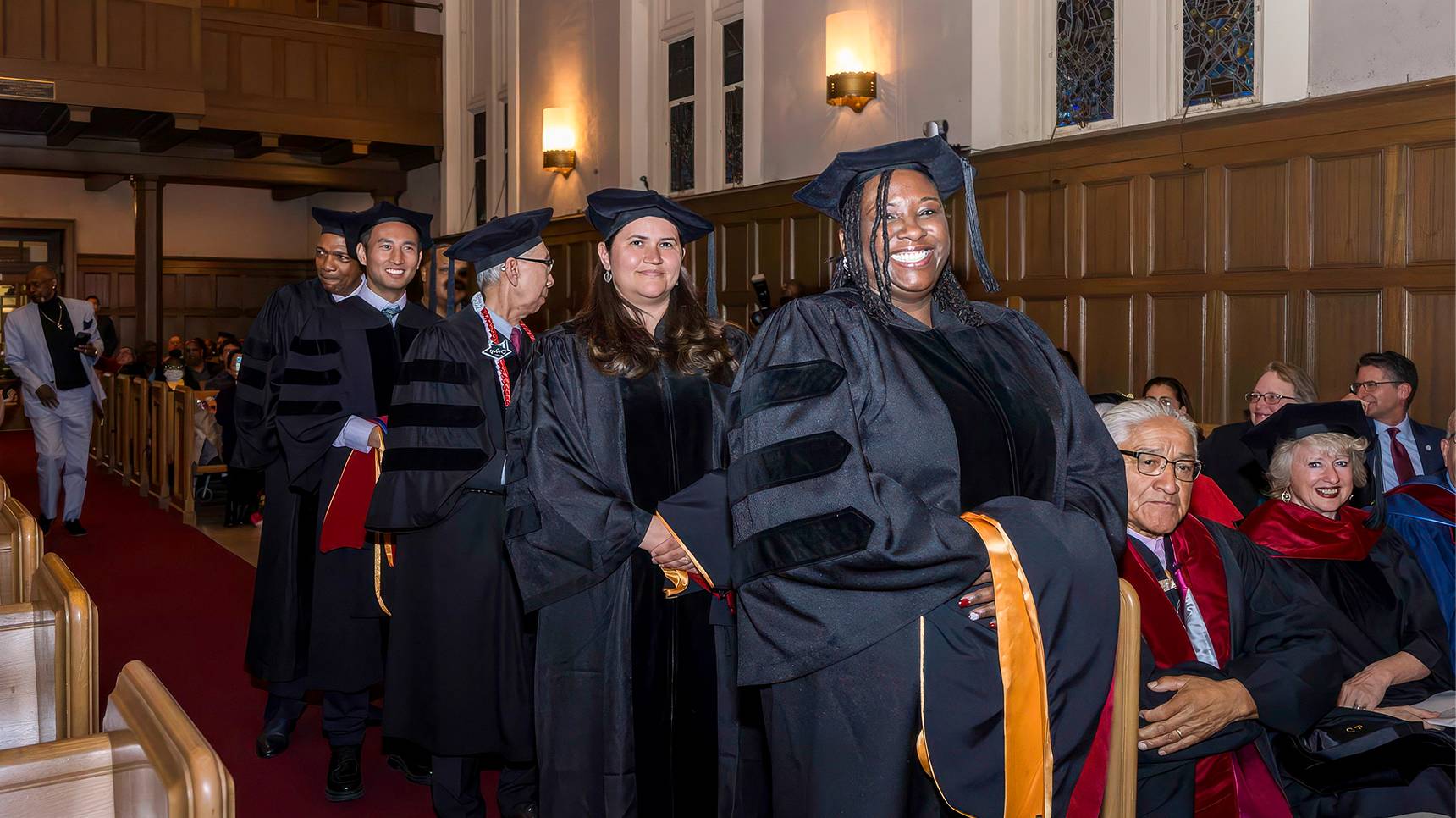 a group of people in graduation gowns