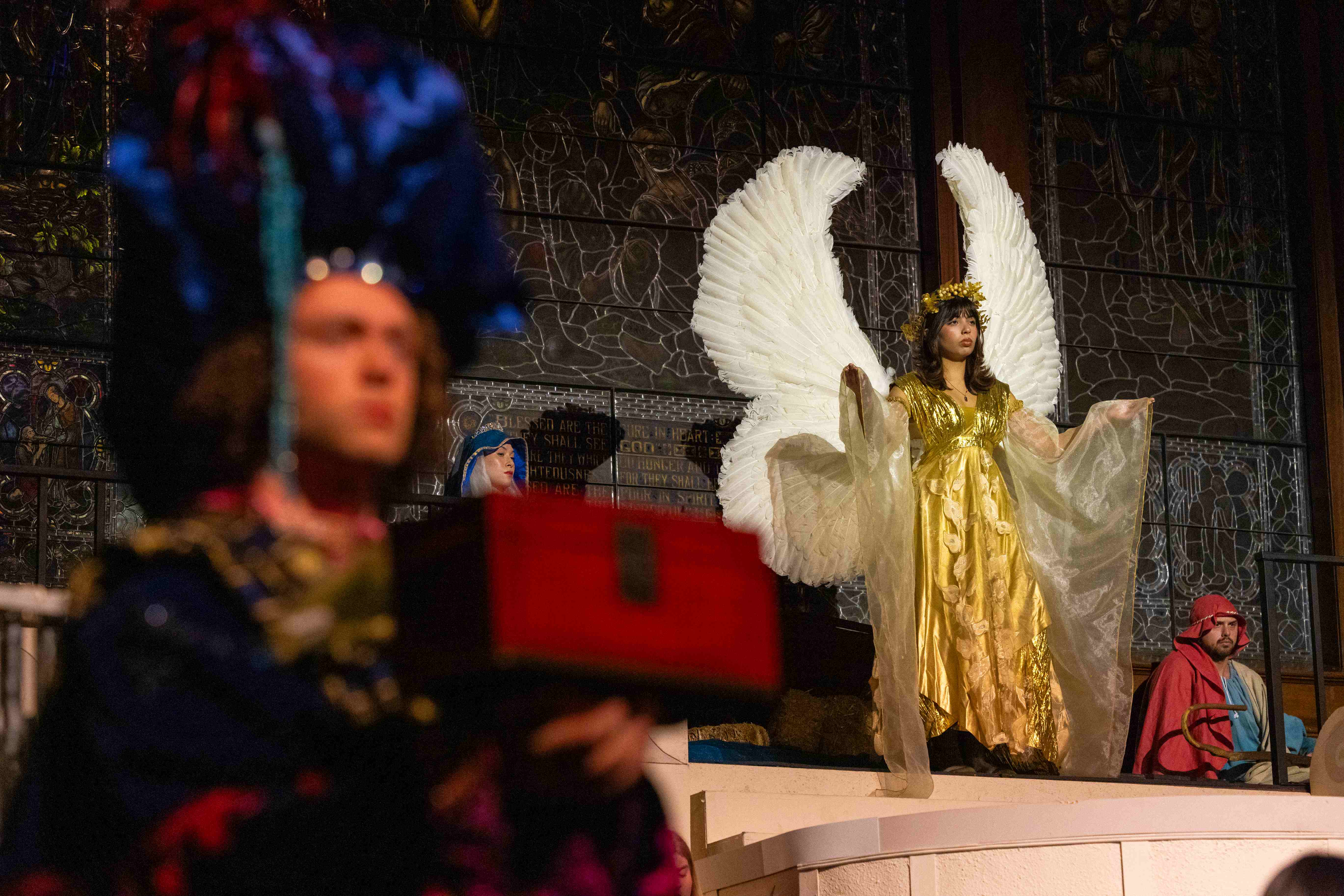 a person wearing angel wings and a crown