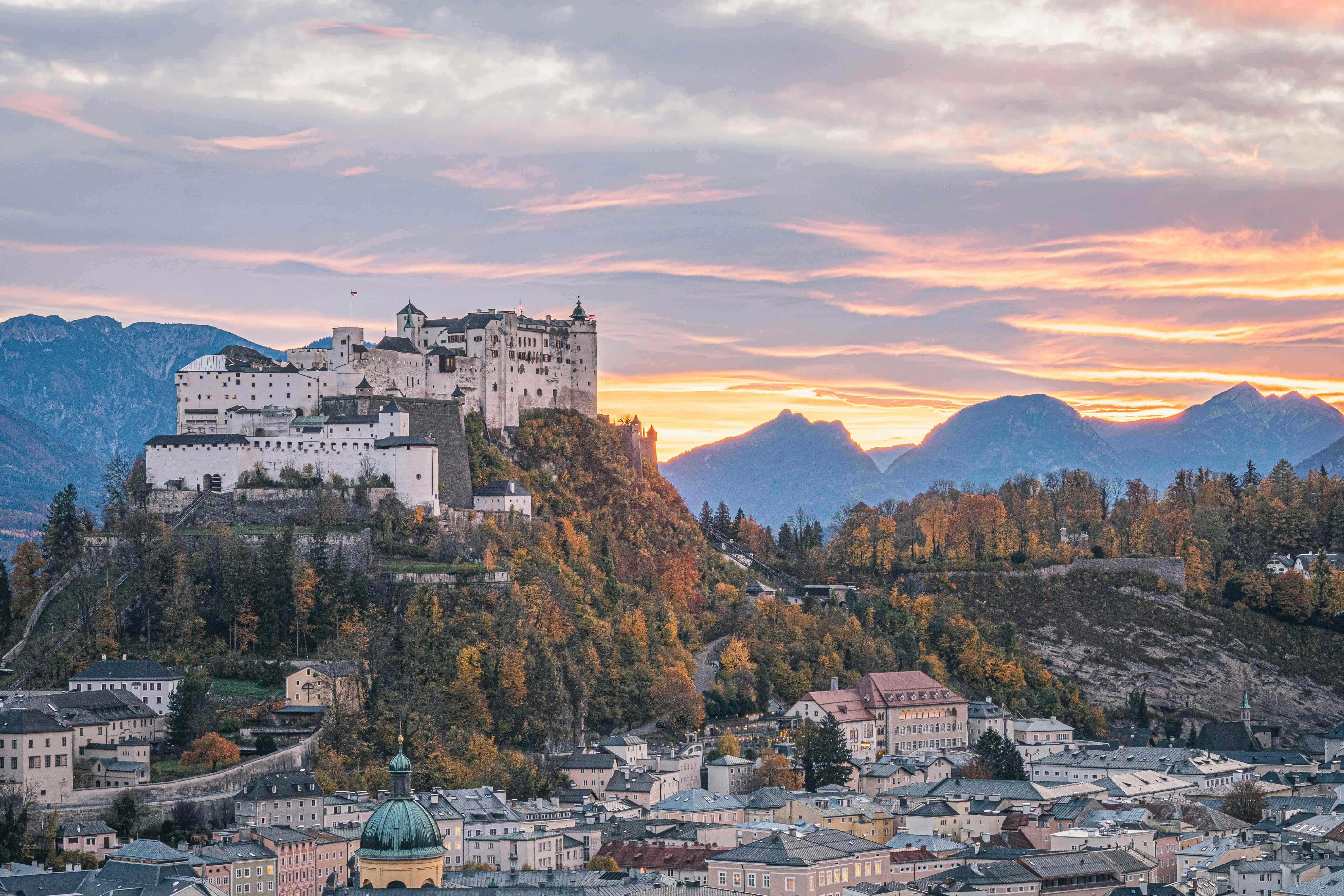 a city with a castle on a hill