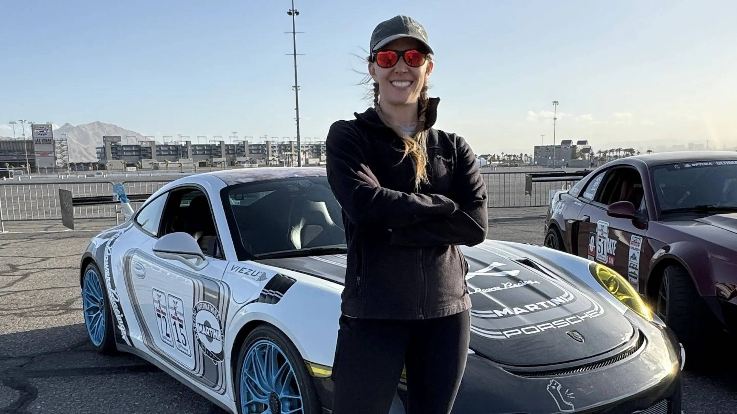 a person standing in front of a car
