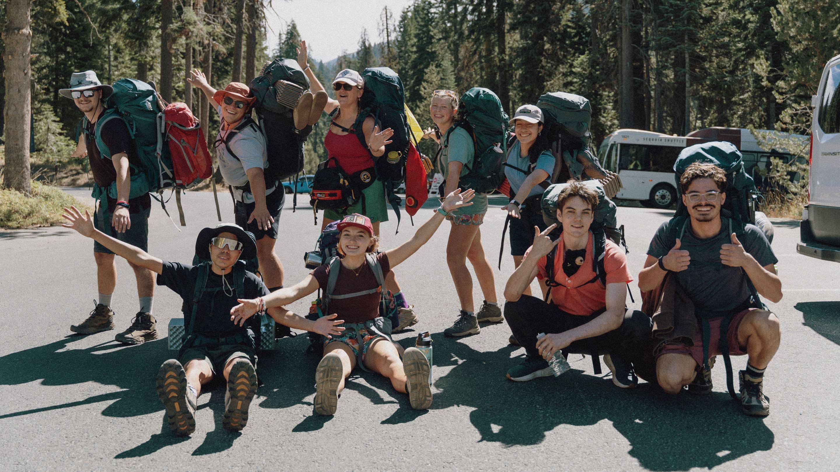 a group of people with backpacks