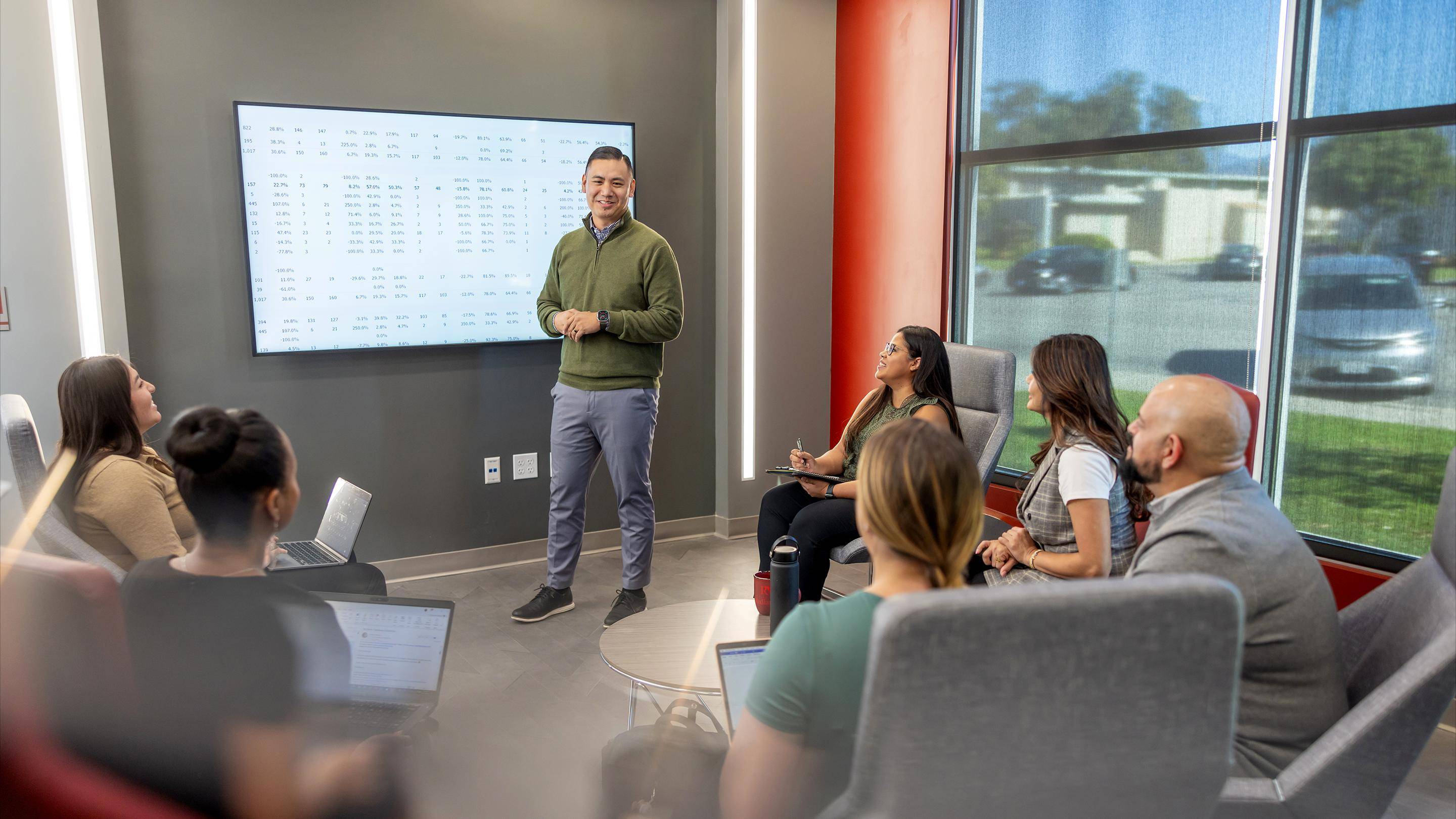 a person standing in front of a screen