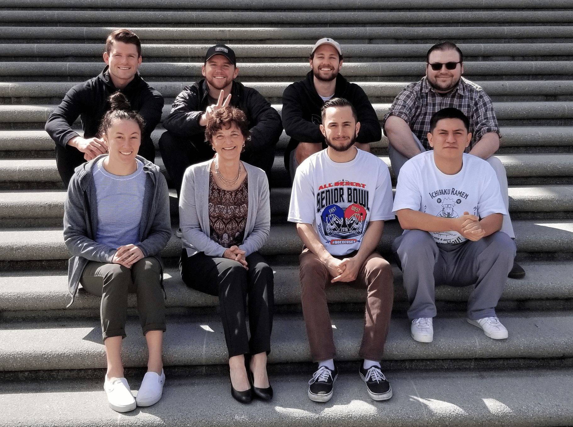 a group of people sitting on stairs