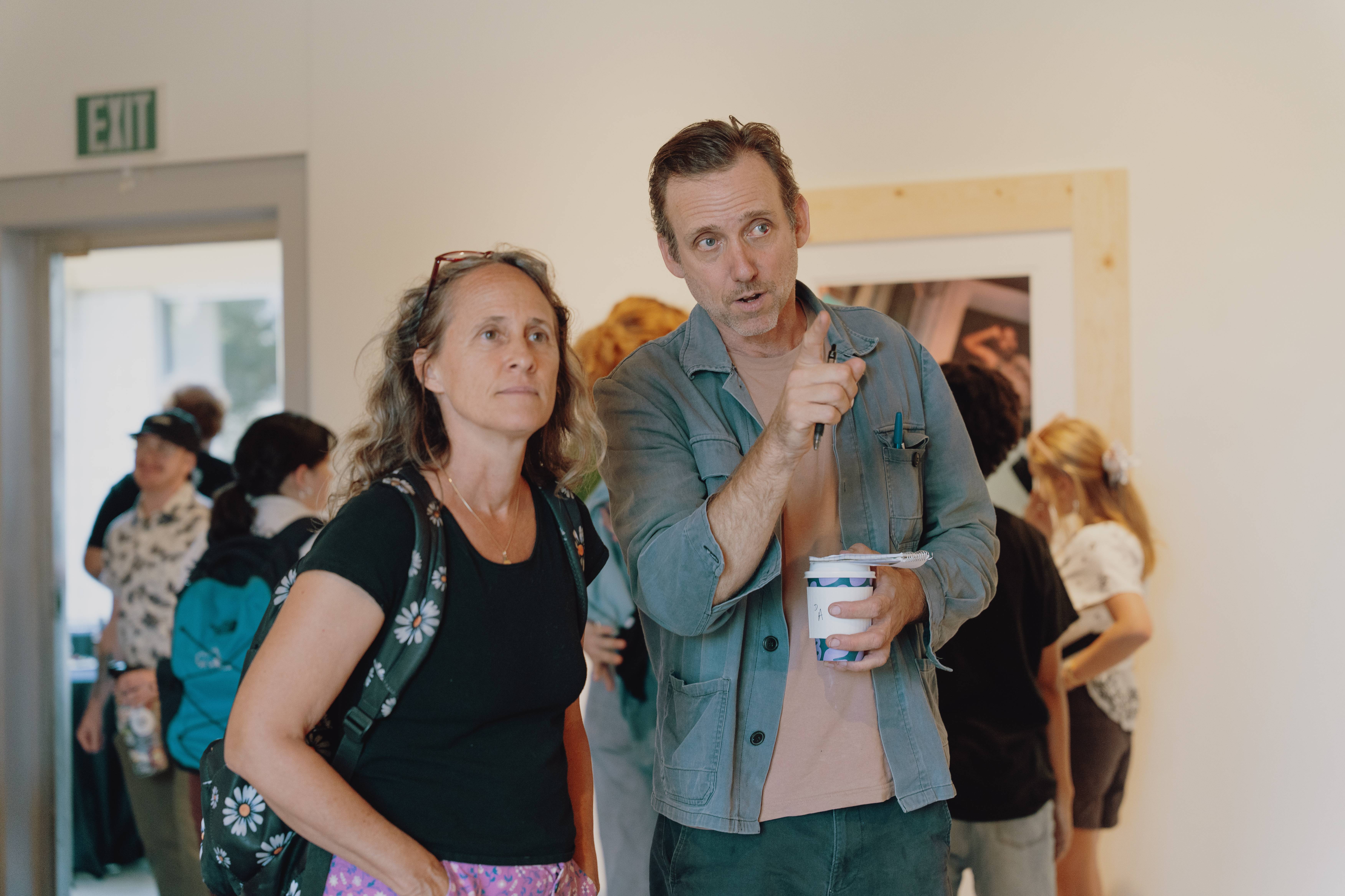 a person and person standing in a room