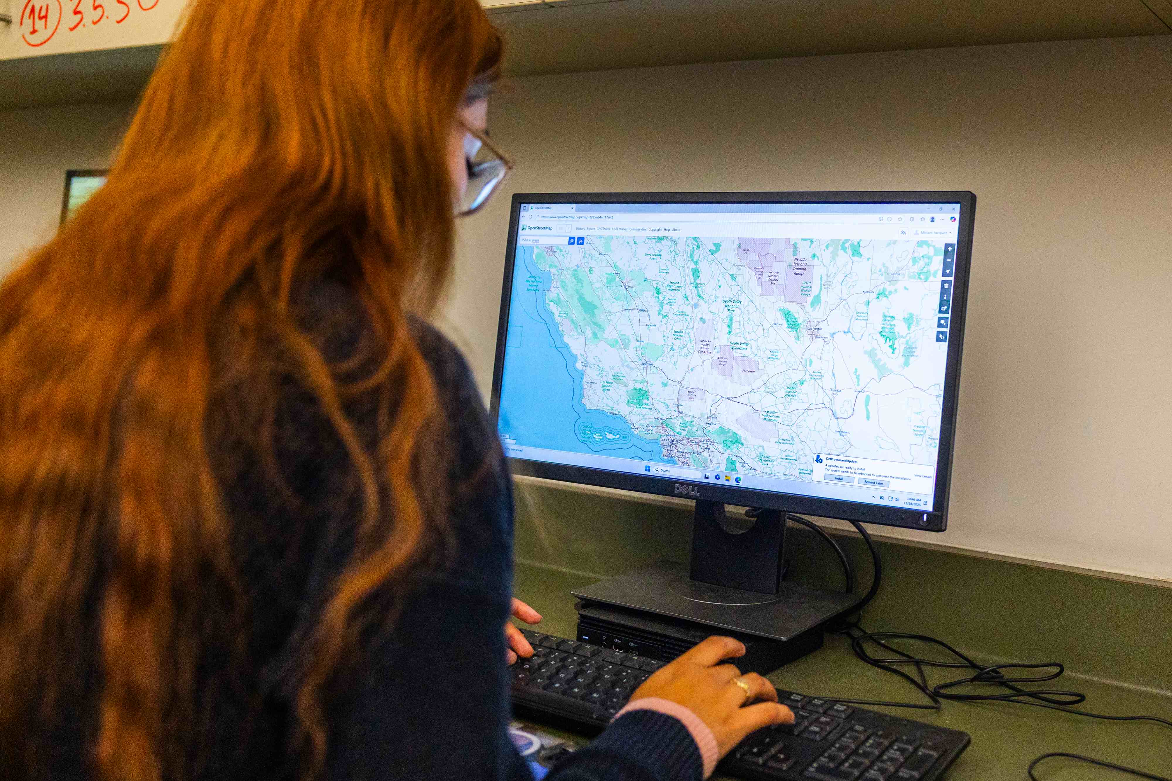 a person sitting at a computer