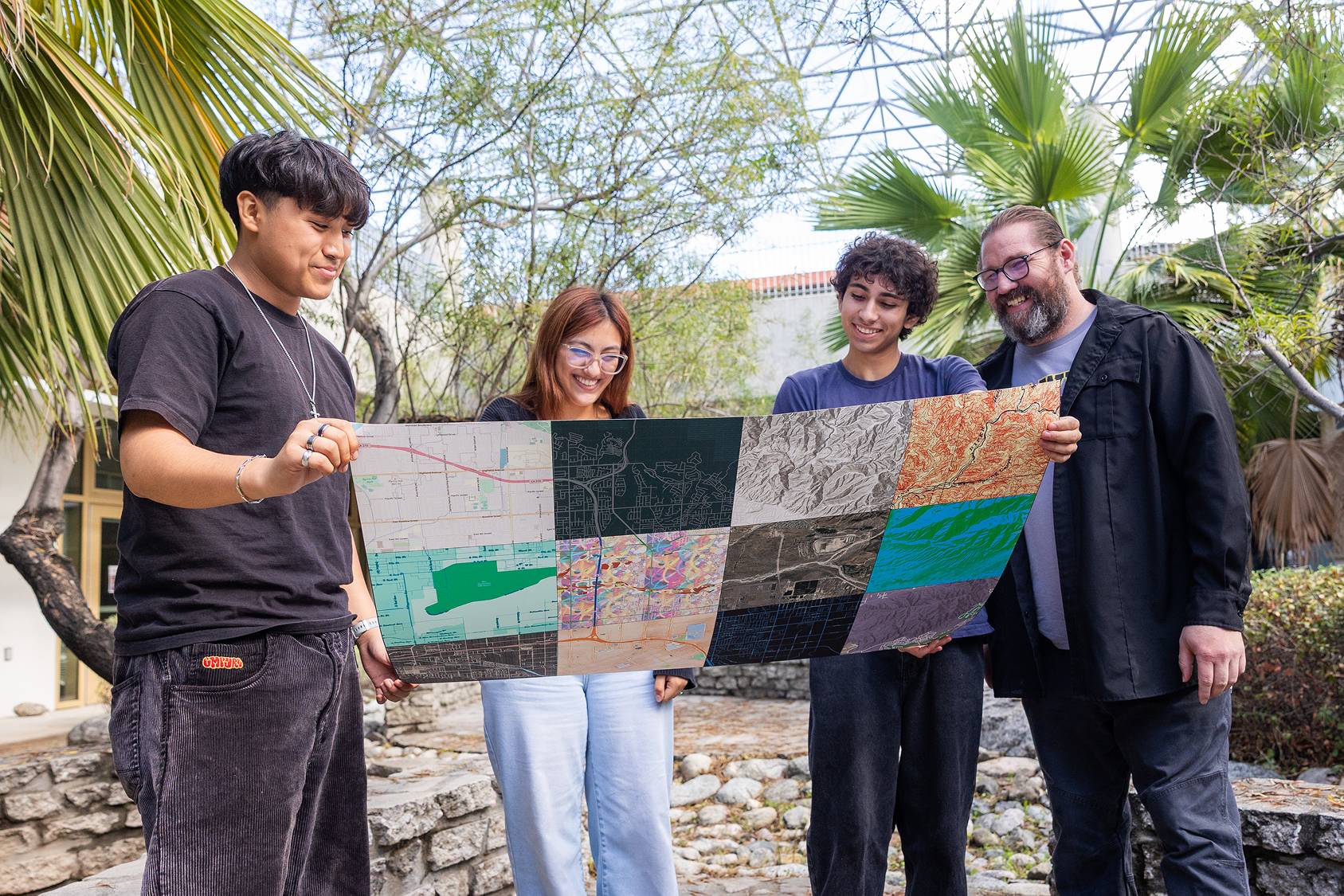 a group of people holding a map
