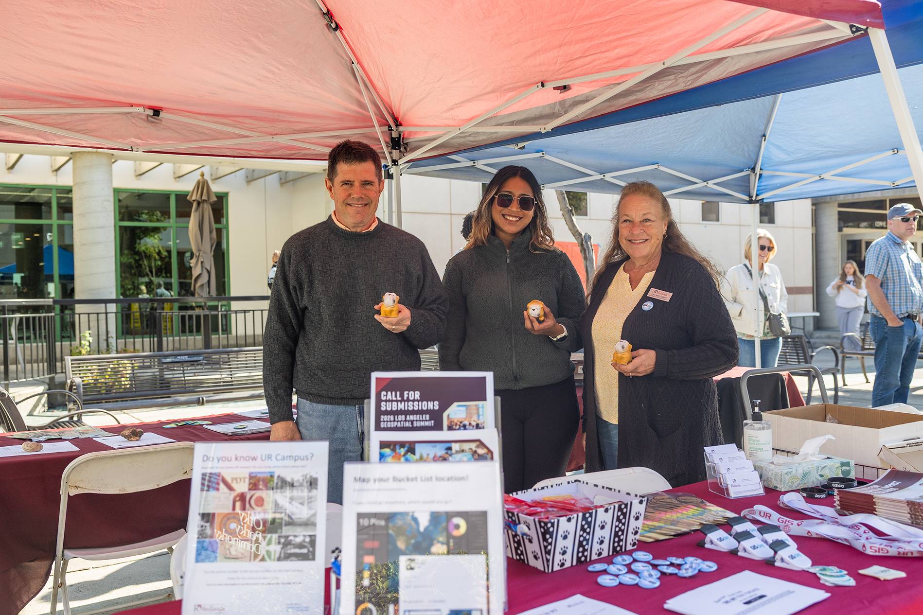 a group of people standing under a tent
