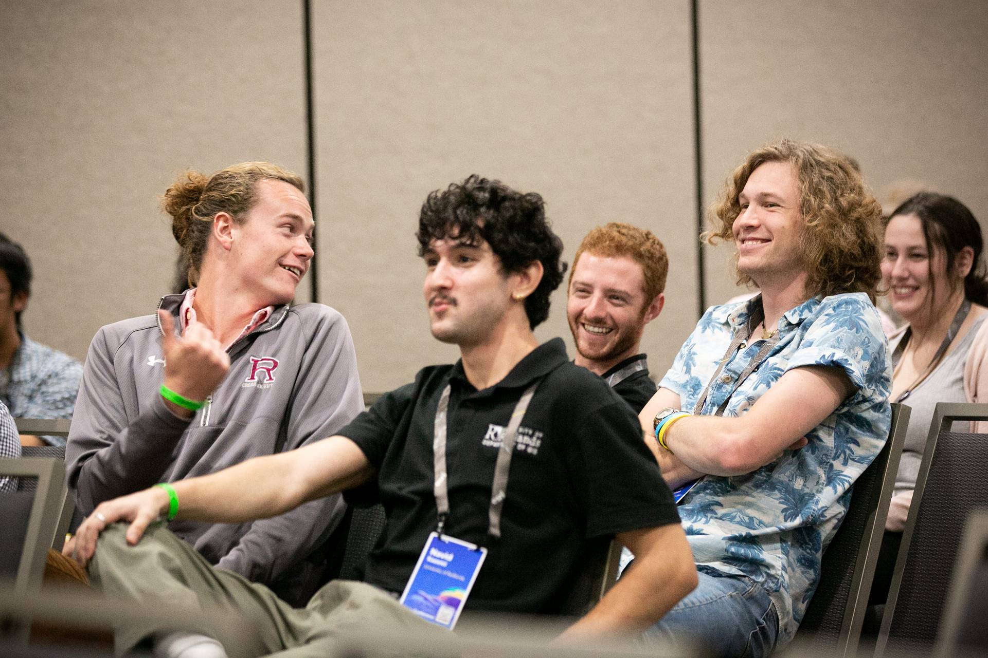 a group of men sitting in a room