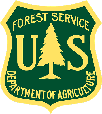 a green and yellow shield with a tree and text