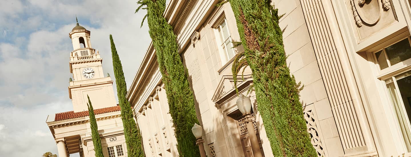 a building with tall trees