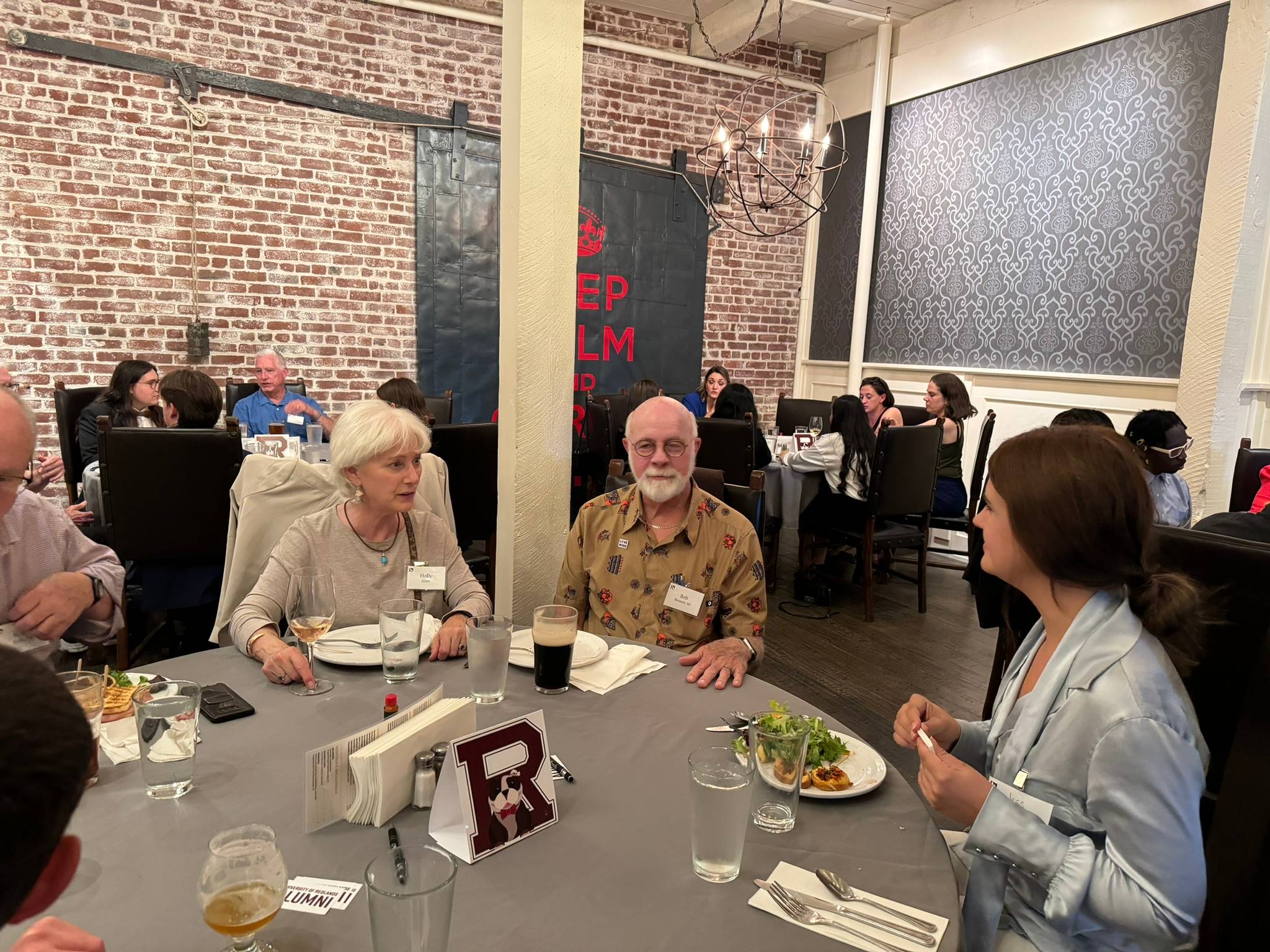 A group of people sitting at a table.