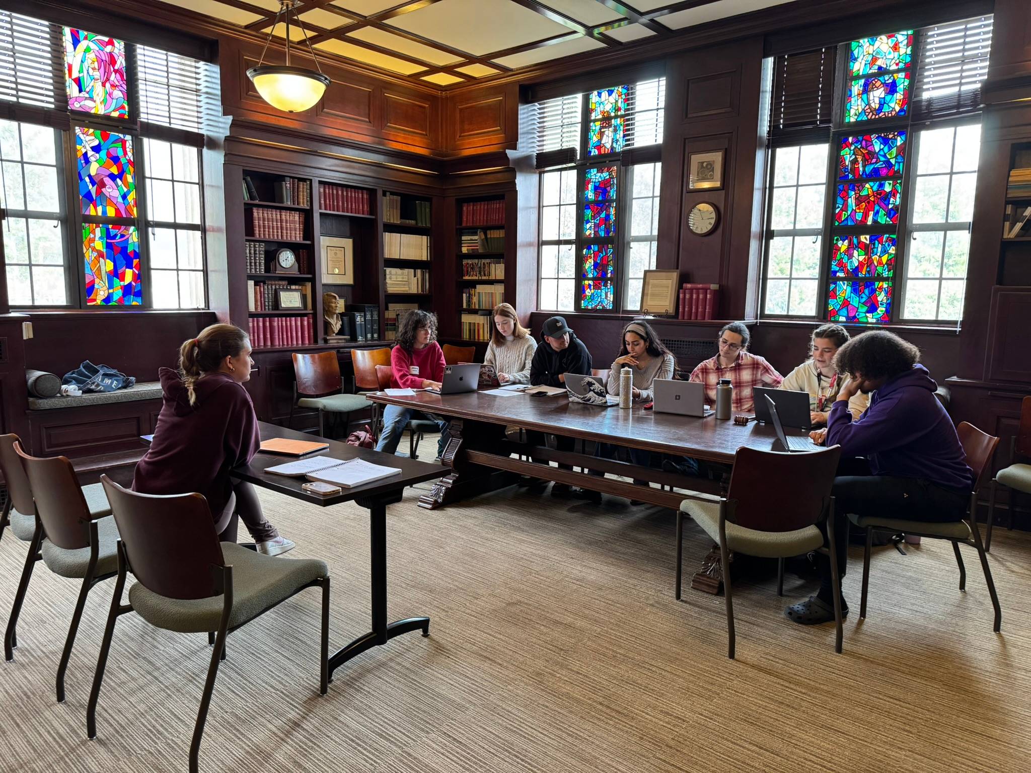 A group of students sitting around a table.