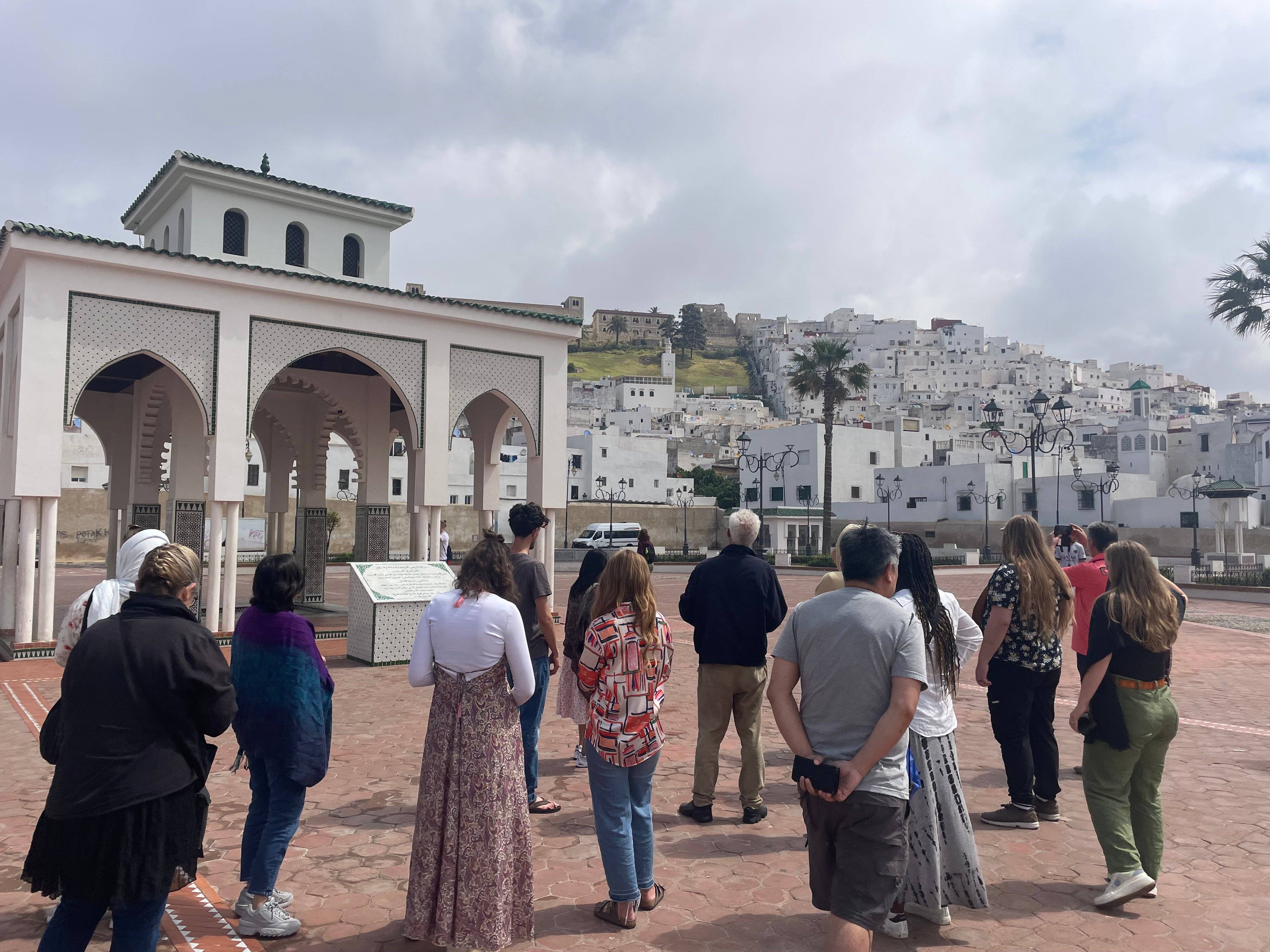 a group of people standing in a courtyard