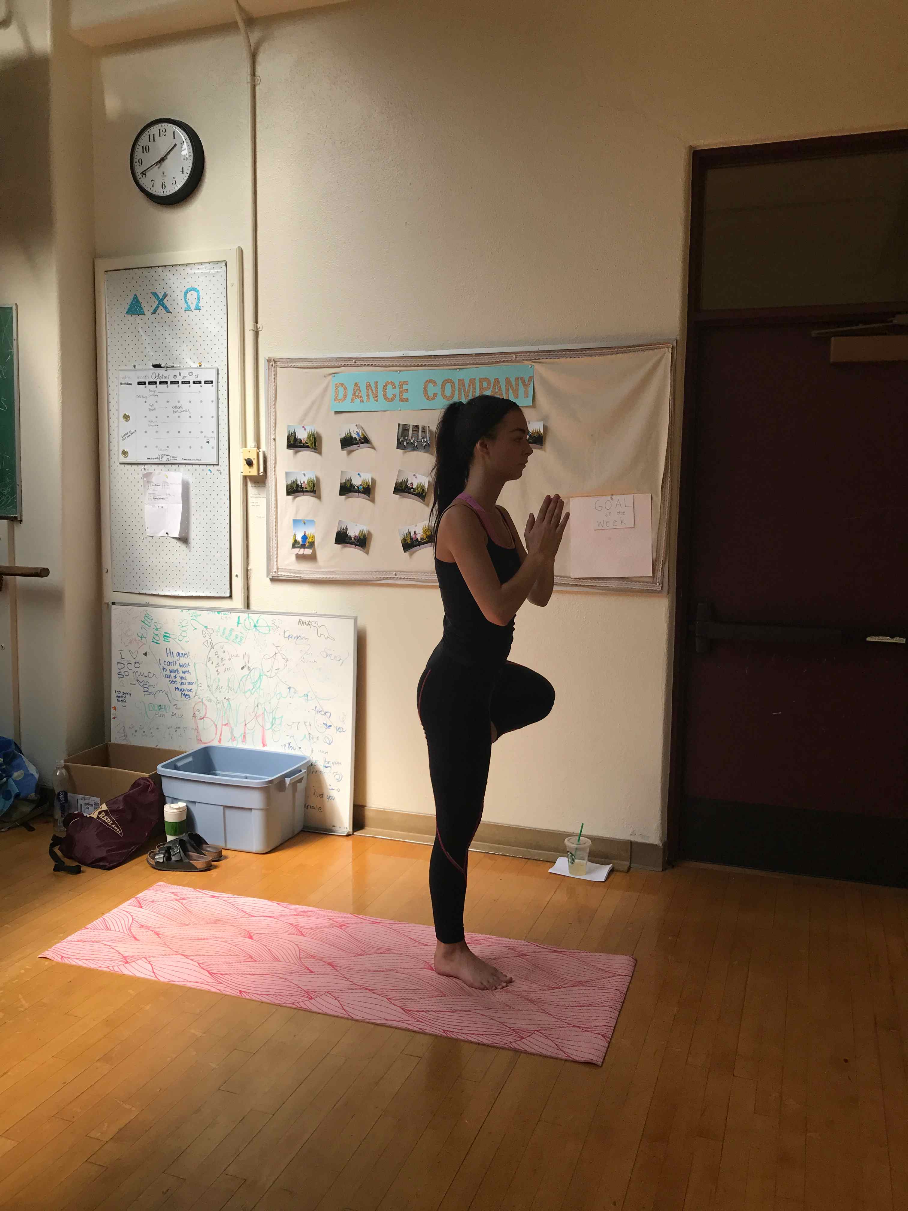 a person standing on one leg in a yoga pose