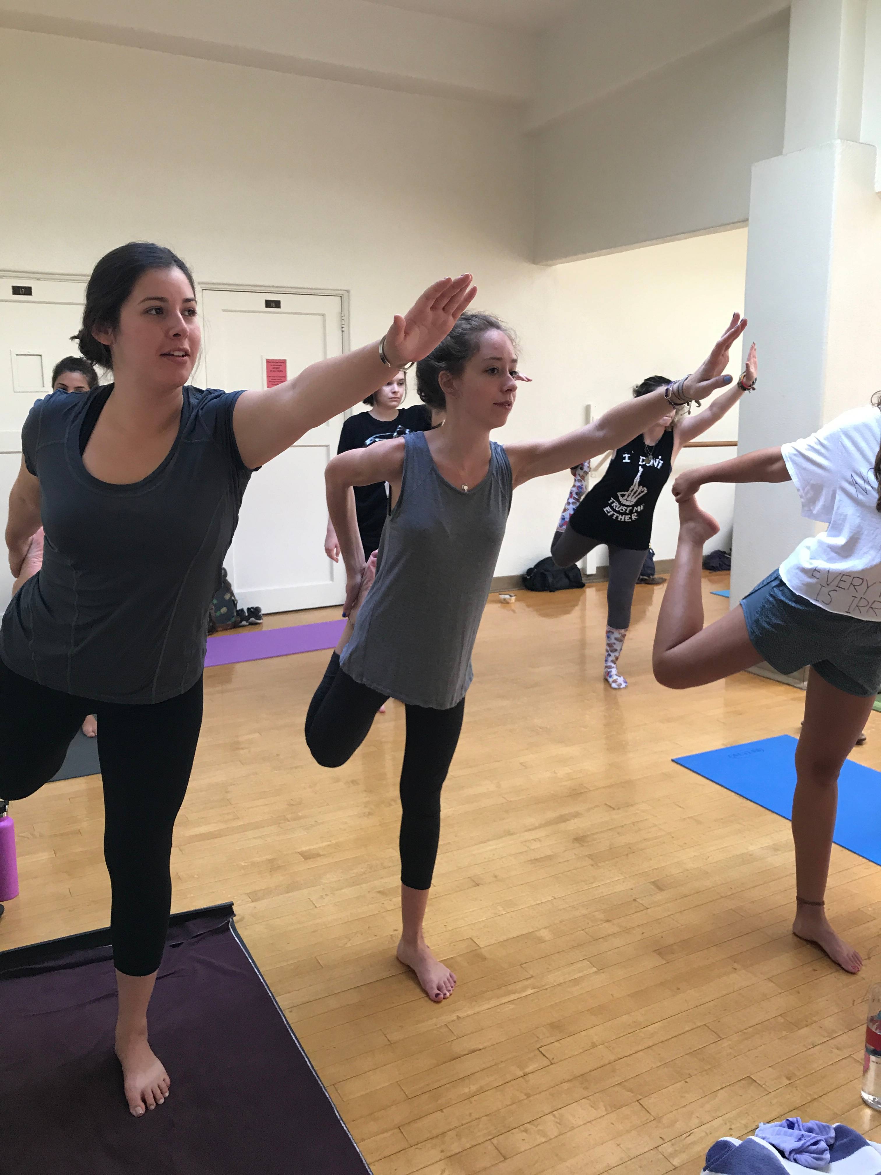 a group of people doing yoga