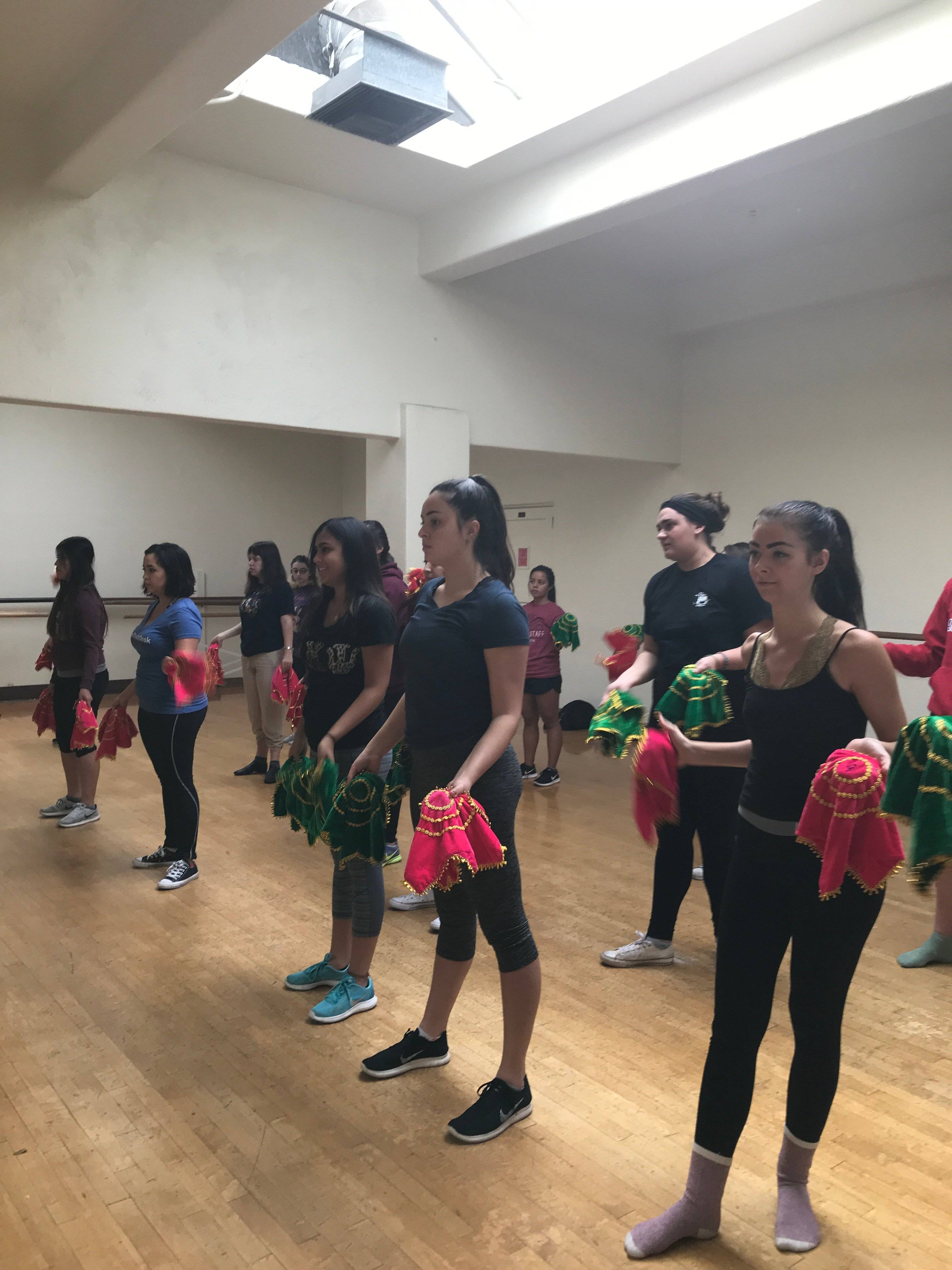 a group of women holding towels