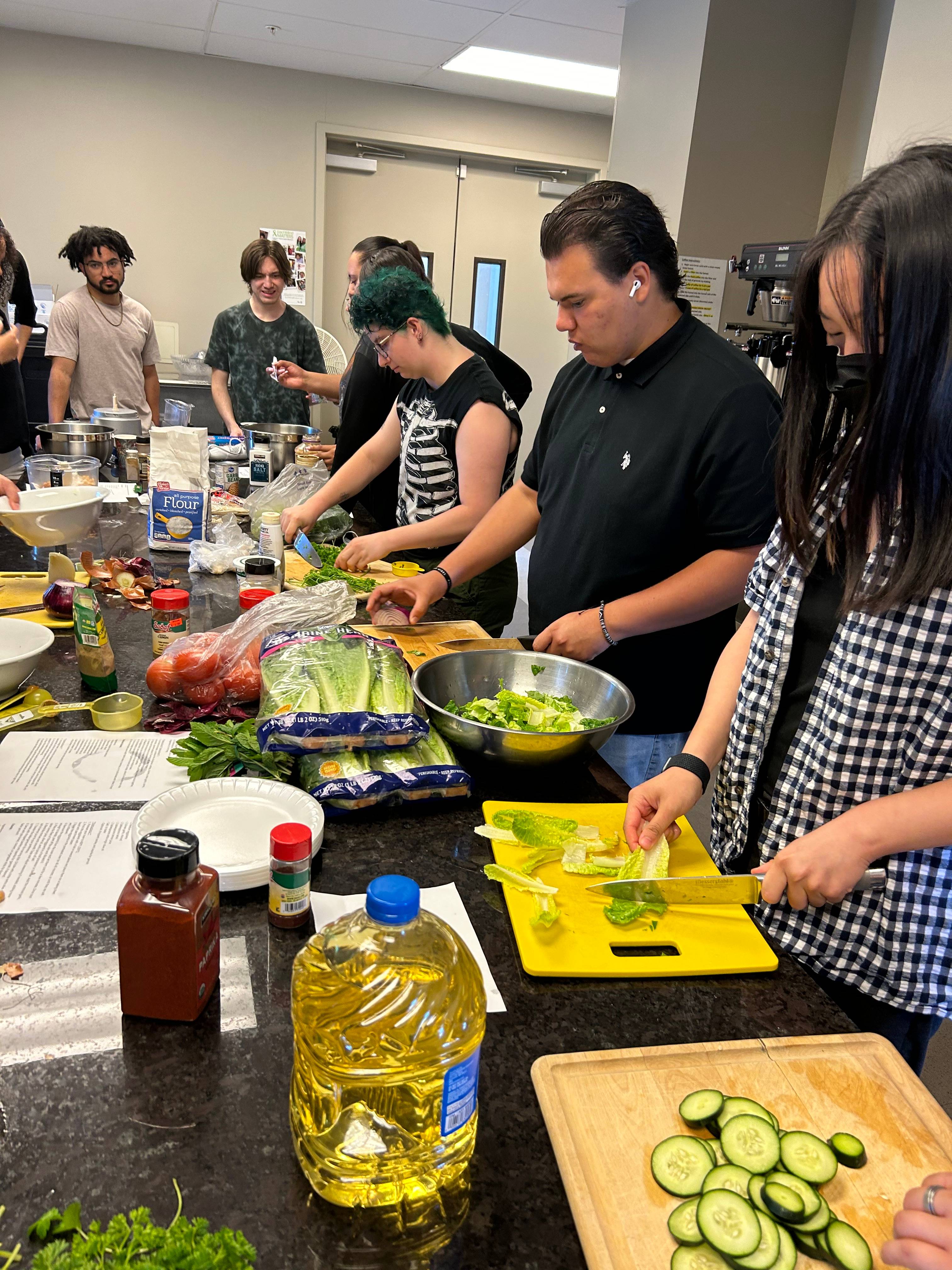 a group of people preparing food