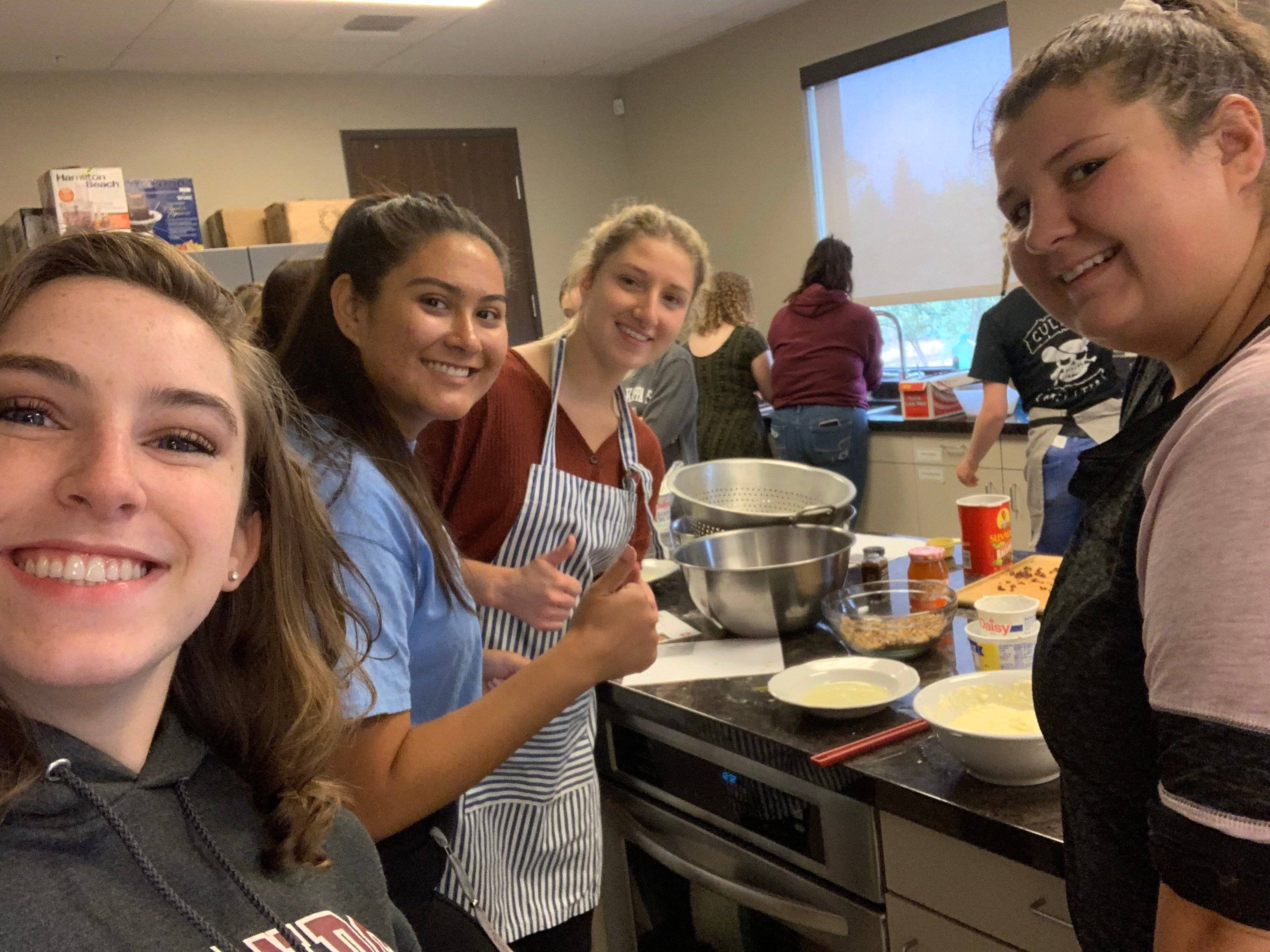 a group of women in a kitchen