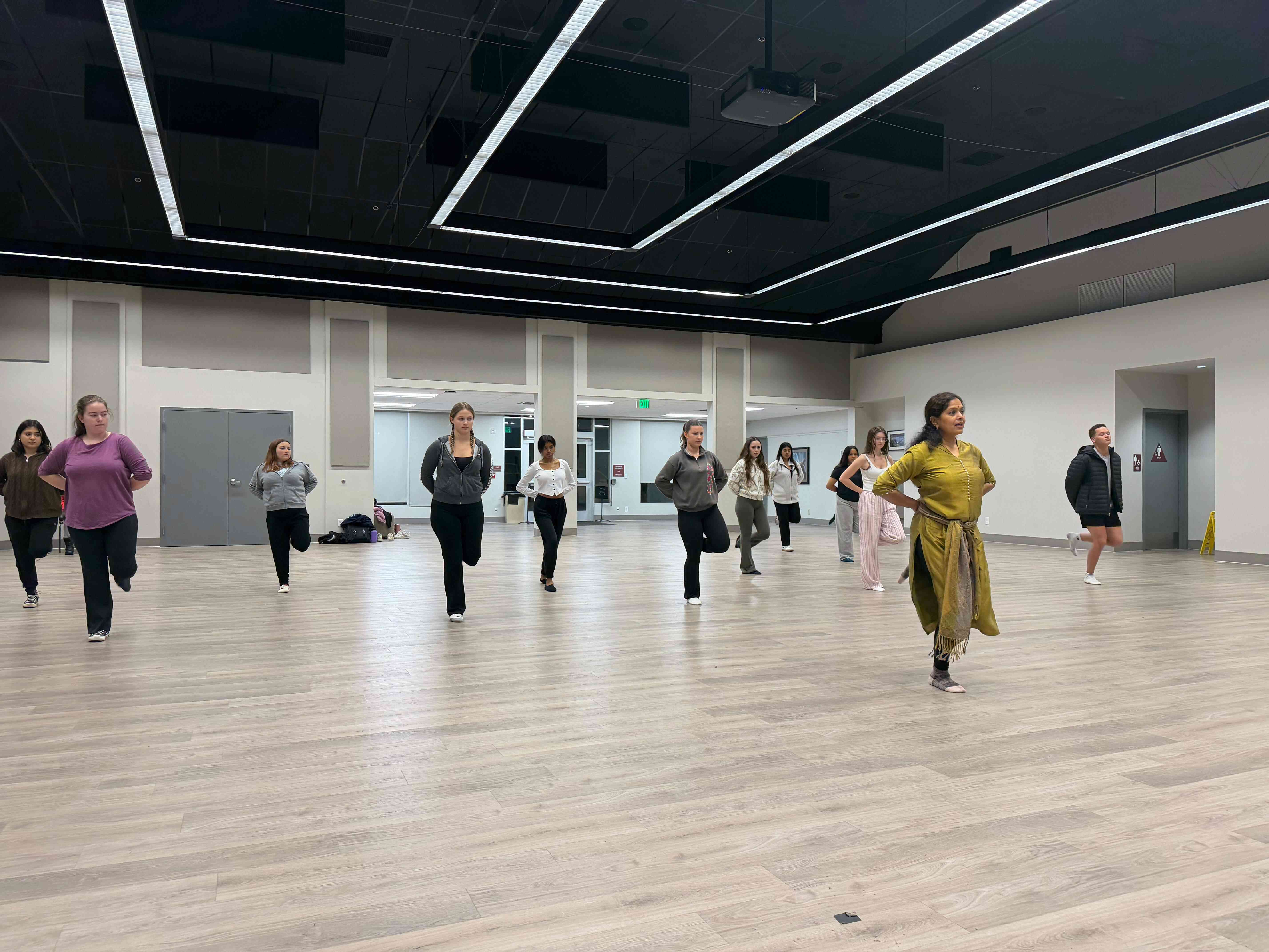 a group of people dancing in a room