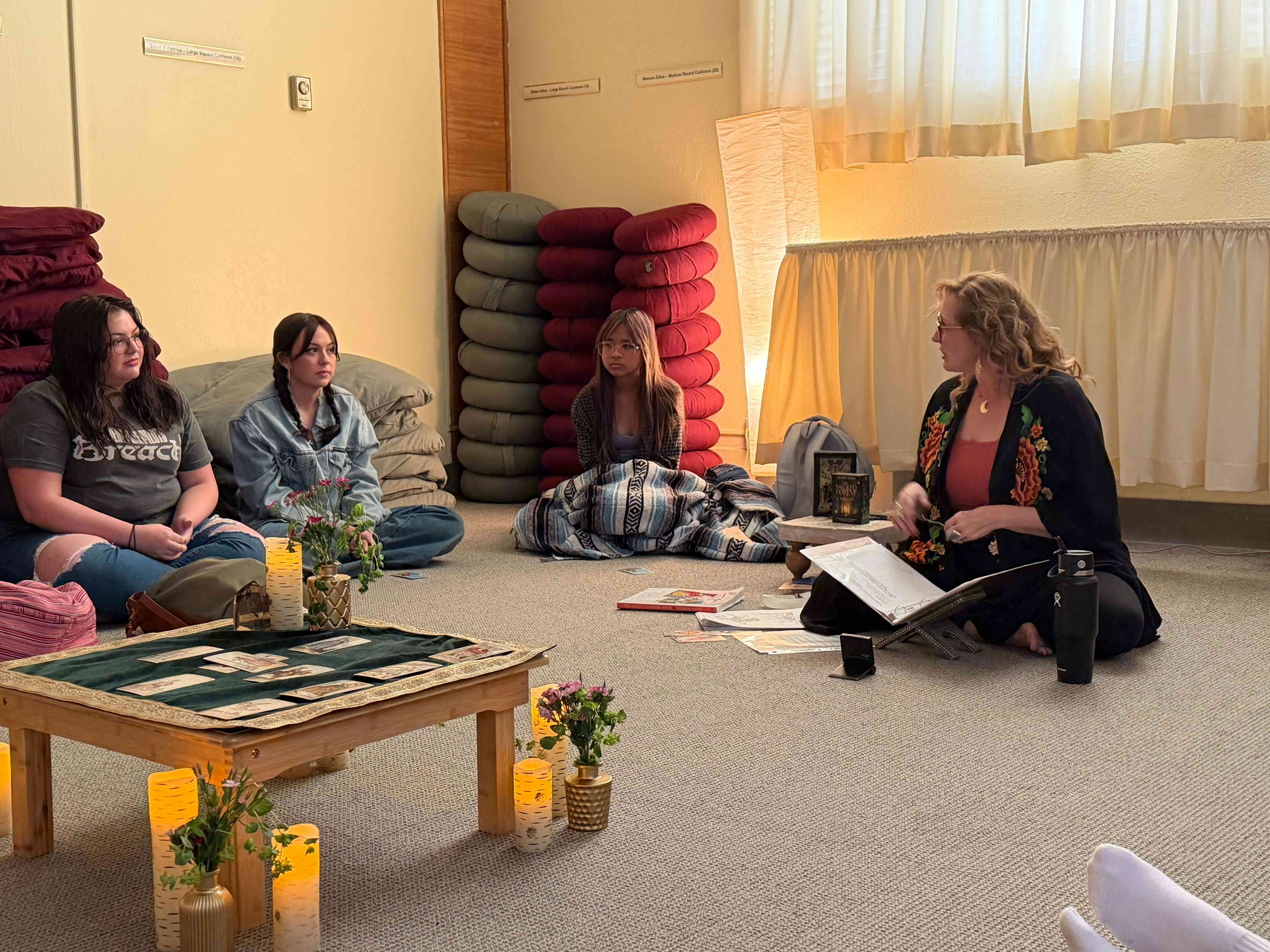 a group of people sitting on the floor
