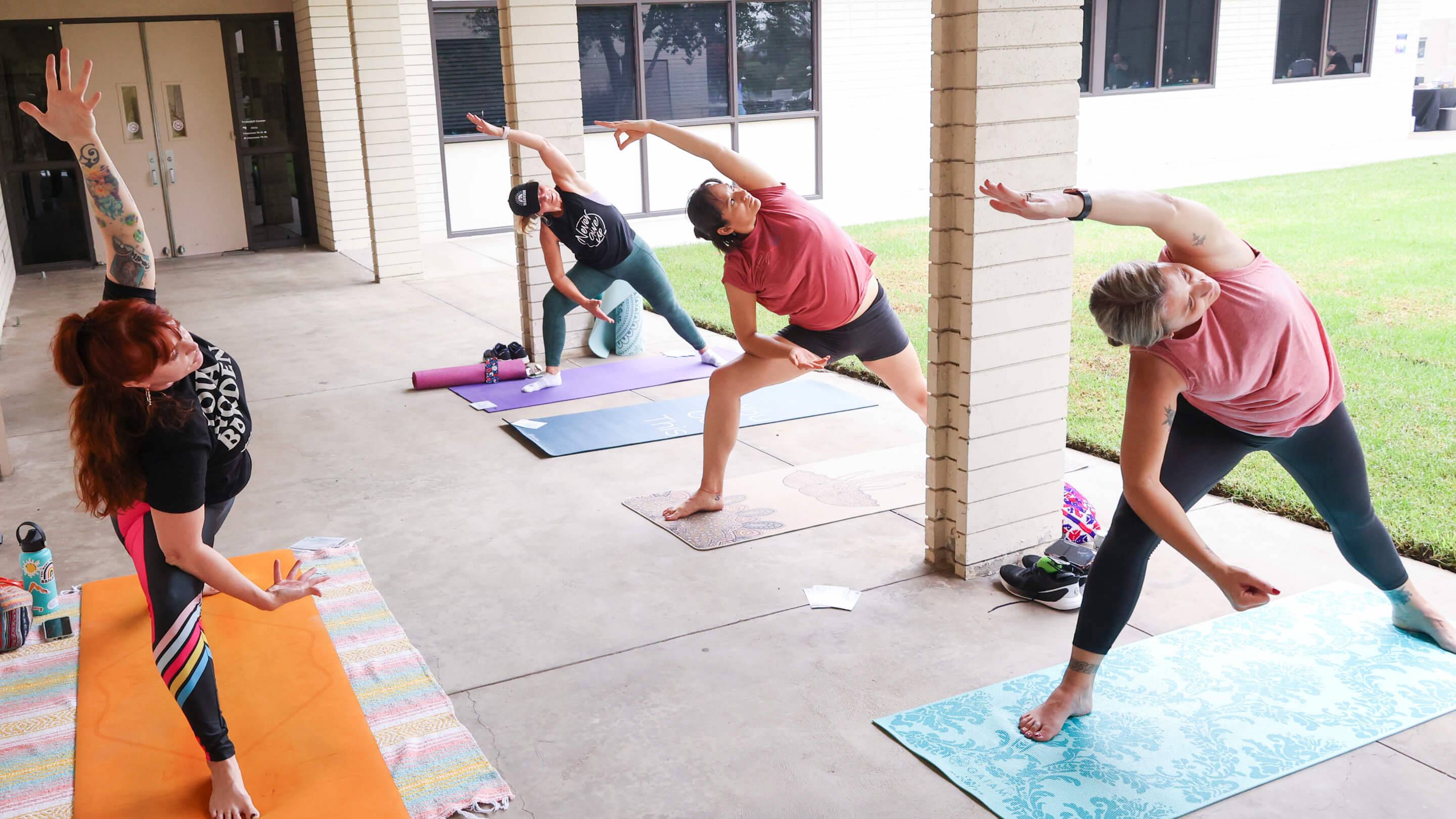 a group of people doing yoga