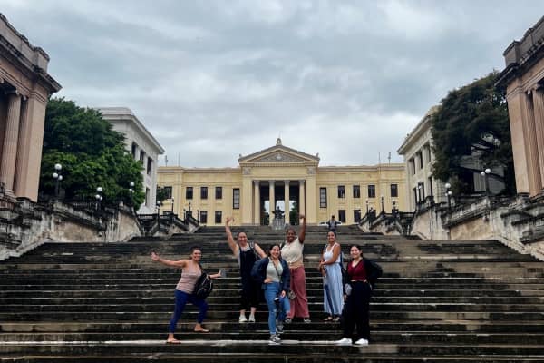 a group of people posing for a picture on a staircase