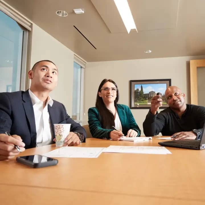 a group of people sitting at a table
