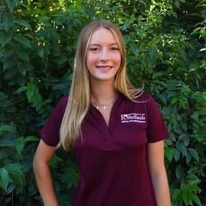 a person in a maroon shirt