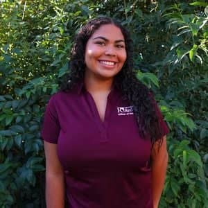 a person in a maroon shirt