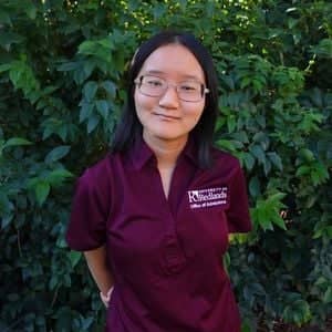 a person in a maroon shirt